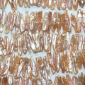 Perlas de agua dulce Biwas color salmón de 40 cm, 24 x 6 mm (aprox.), tira de 40 cm - Precios al por mayor de perlas naturales
