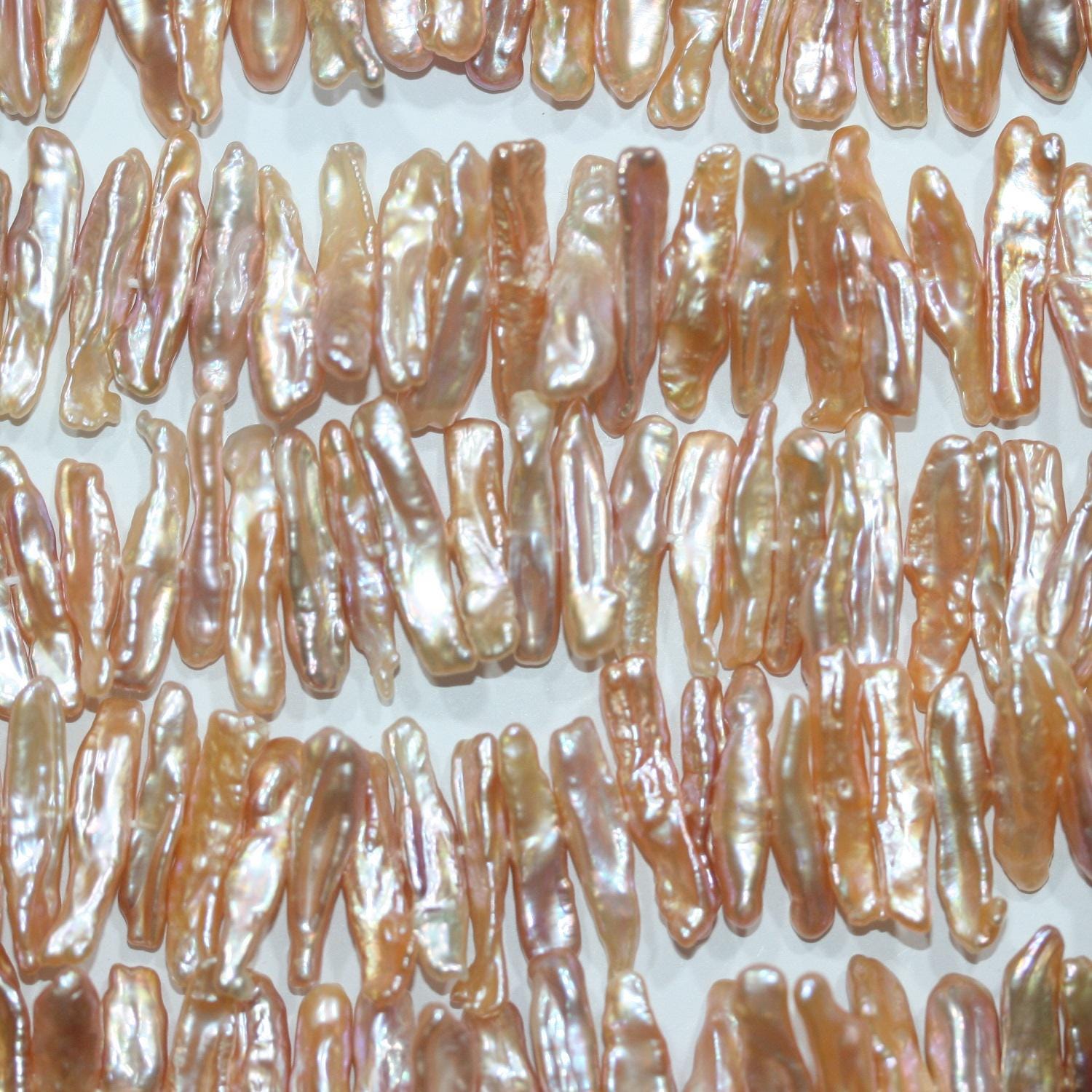 Perles de saumon Biwas d'eau douce St 16" (environ 40 cm), 24 x 6 mm, longueur 40 cm. Perles naturelles à prix de gros.