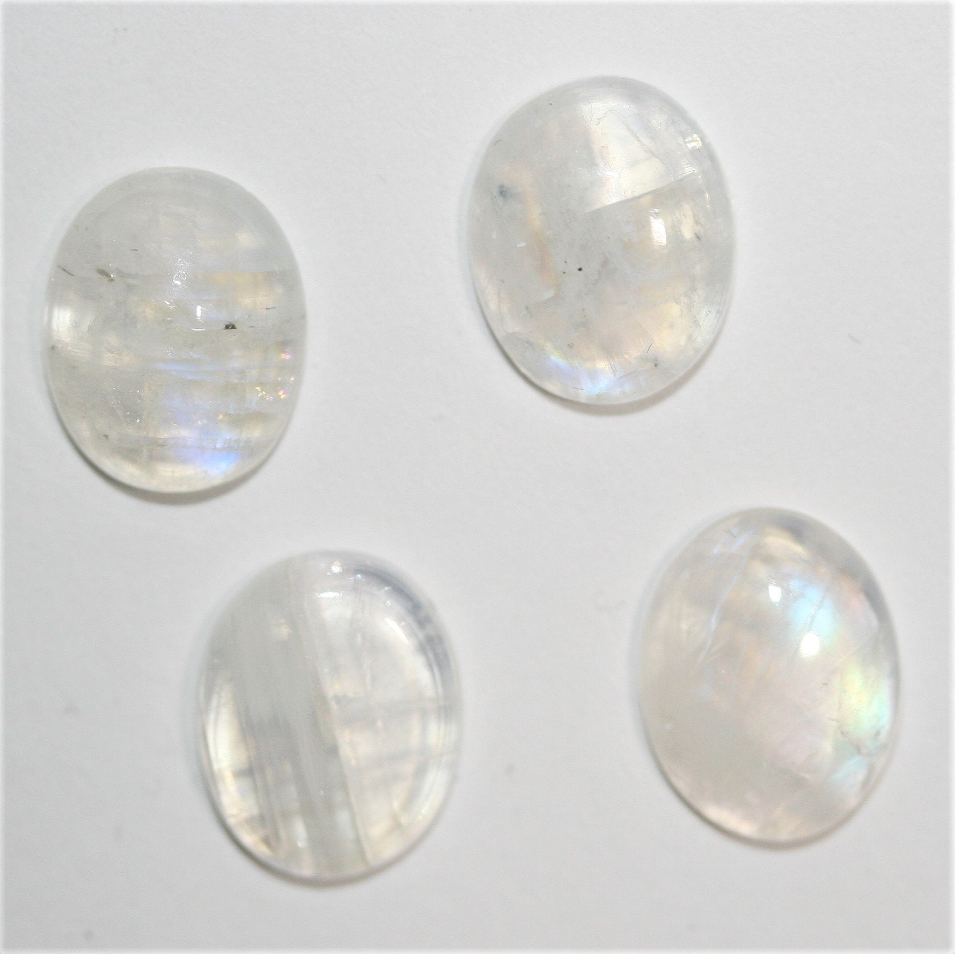 4 cabochons ovales lisses en pierre de lune 10x8mm.- (4 pièces)