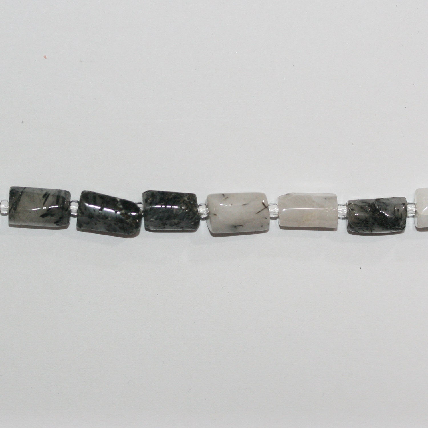 Cuentas de barril liso de cuarzo turmalinado de 16" x 12 x 6 mm. Aprox. - Hilo de 40 cm.