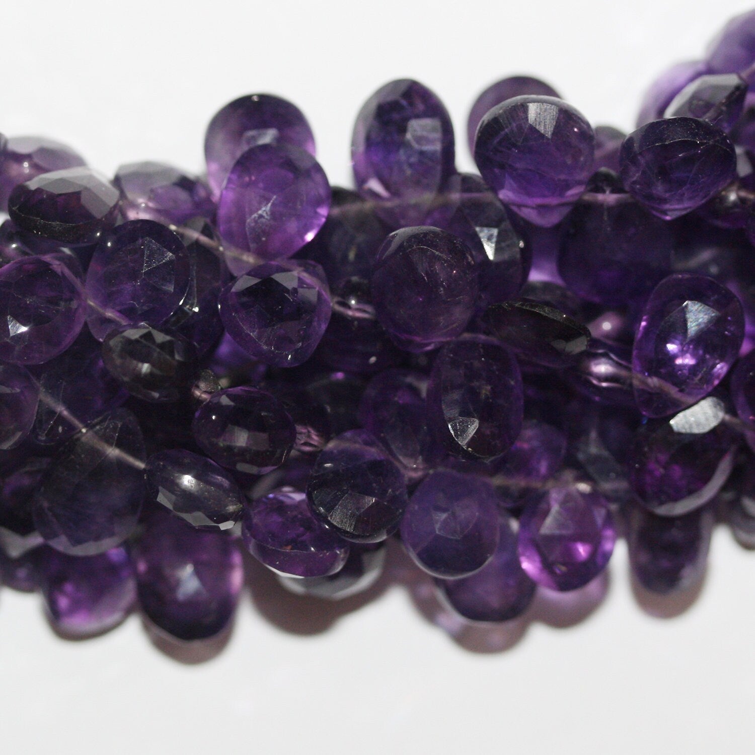 Cuentas de amatista facetadas de 8" x 12 x 9 mm (aprox.), hilo de 20 mm.
