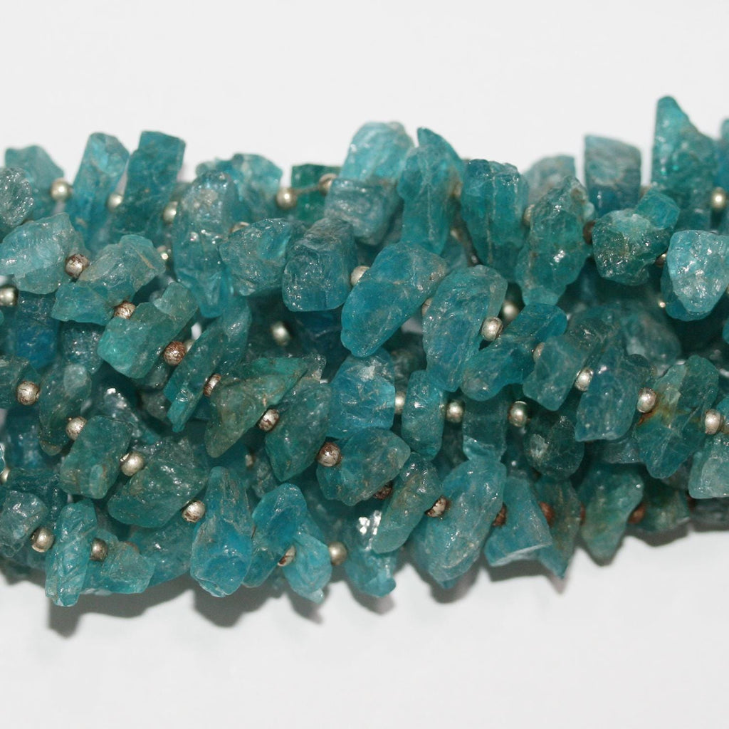 Cuentas de apatita azul sin pulir de 8" (5 x 12 mm). Hilo de 20 cm aprox.