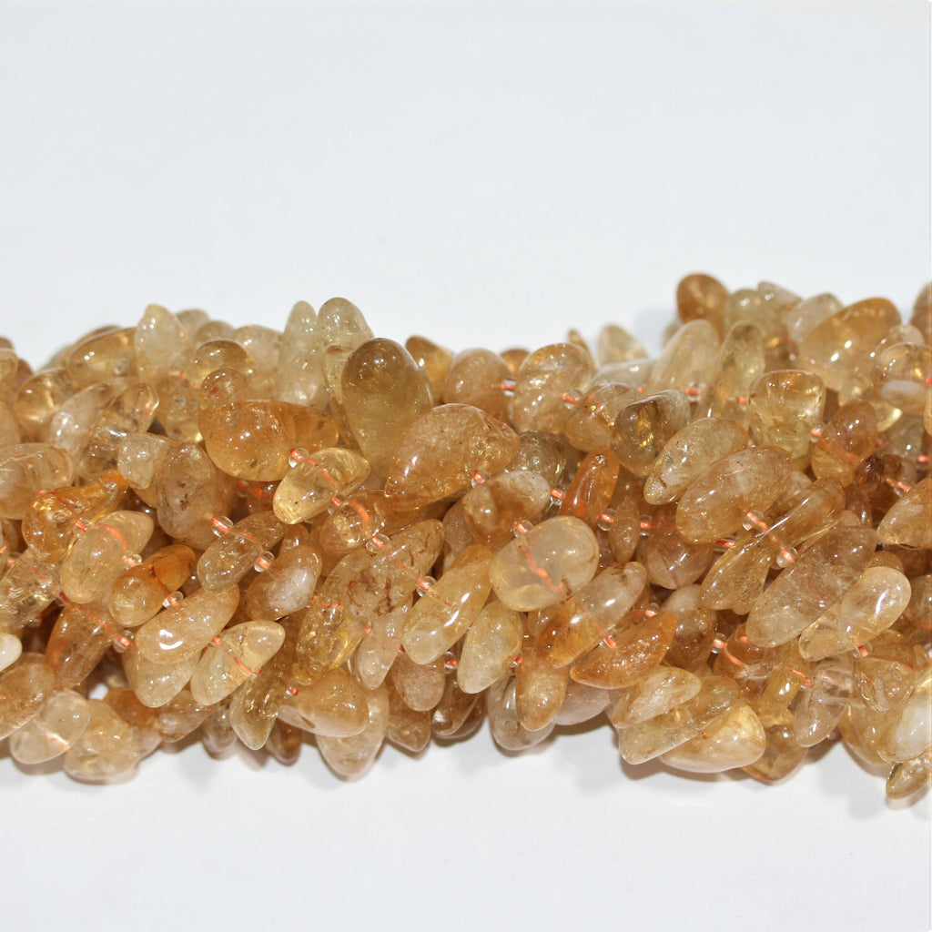 Perles de citrine St. Citrine lisses et irrégulières de 15 pouces (10 x 5 mm - 28 x 10 mm). Longueur approximative du fil : 39 cm.