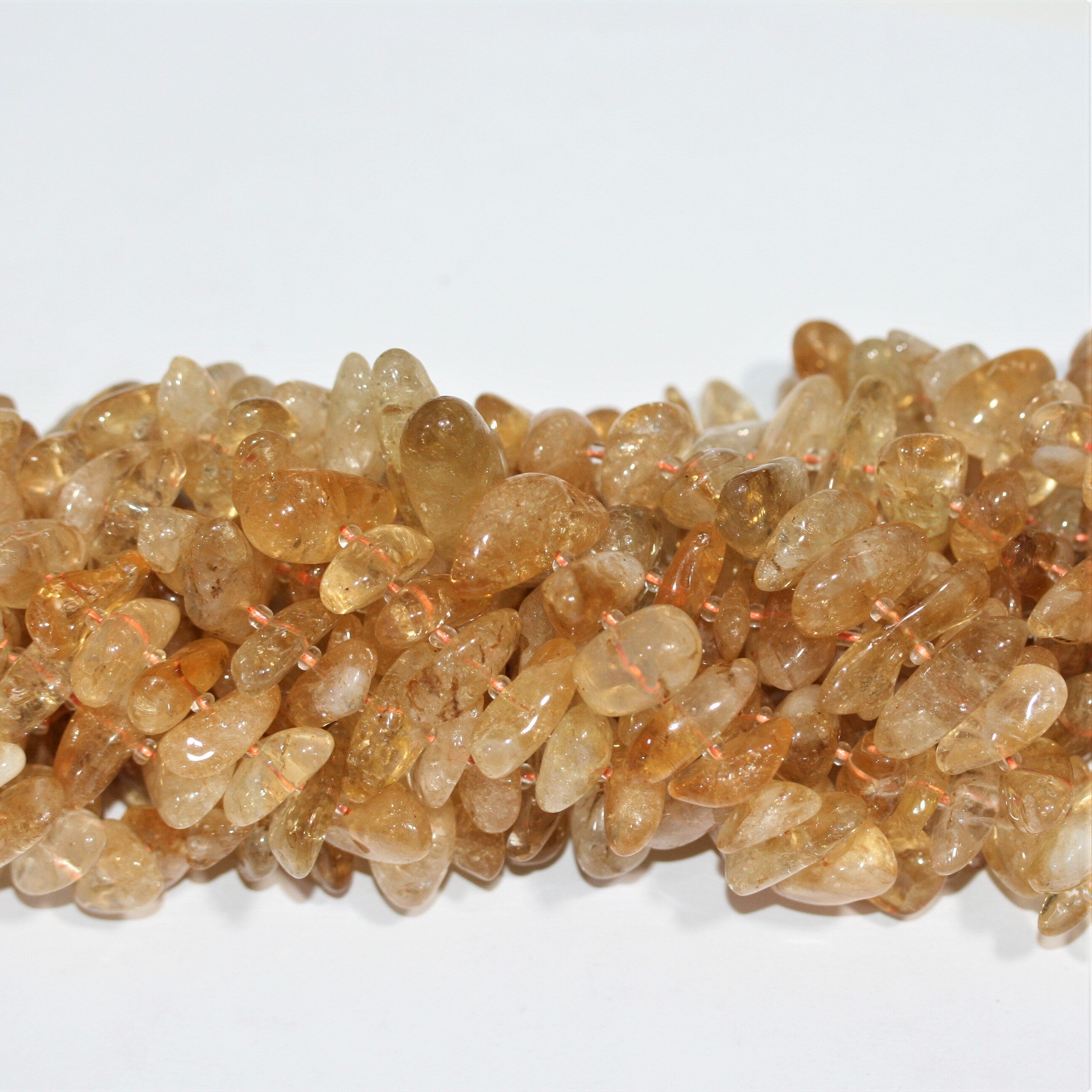 Perles de citrine St. Citrine lisses et irrégulières de 15 pouces (10 x 5 mm - 28 x 10 mm). Longueur approximative du fil : 39 cm.
