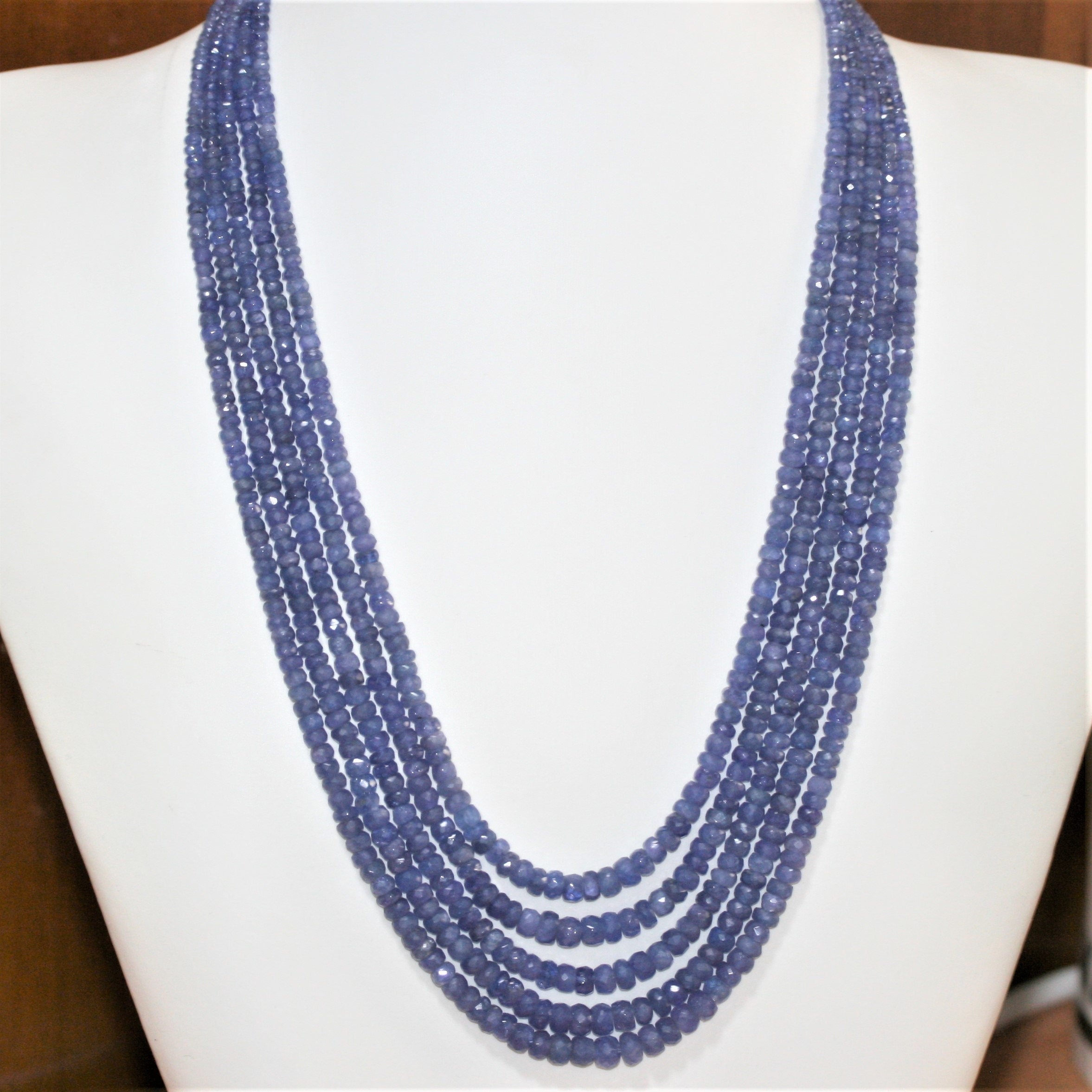 Collier de 5 rangs de rondelles à facettes dégradées en tanzanite (3 x 2 à 6 x 4 mm).