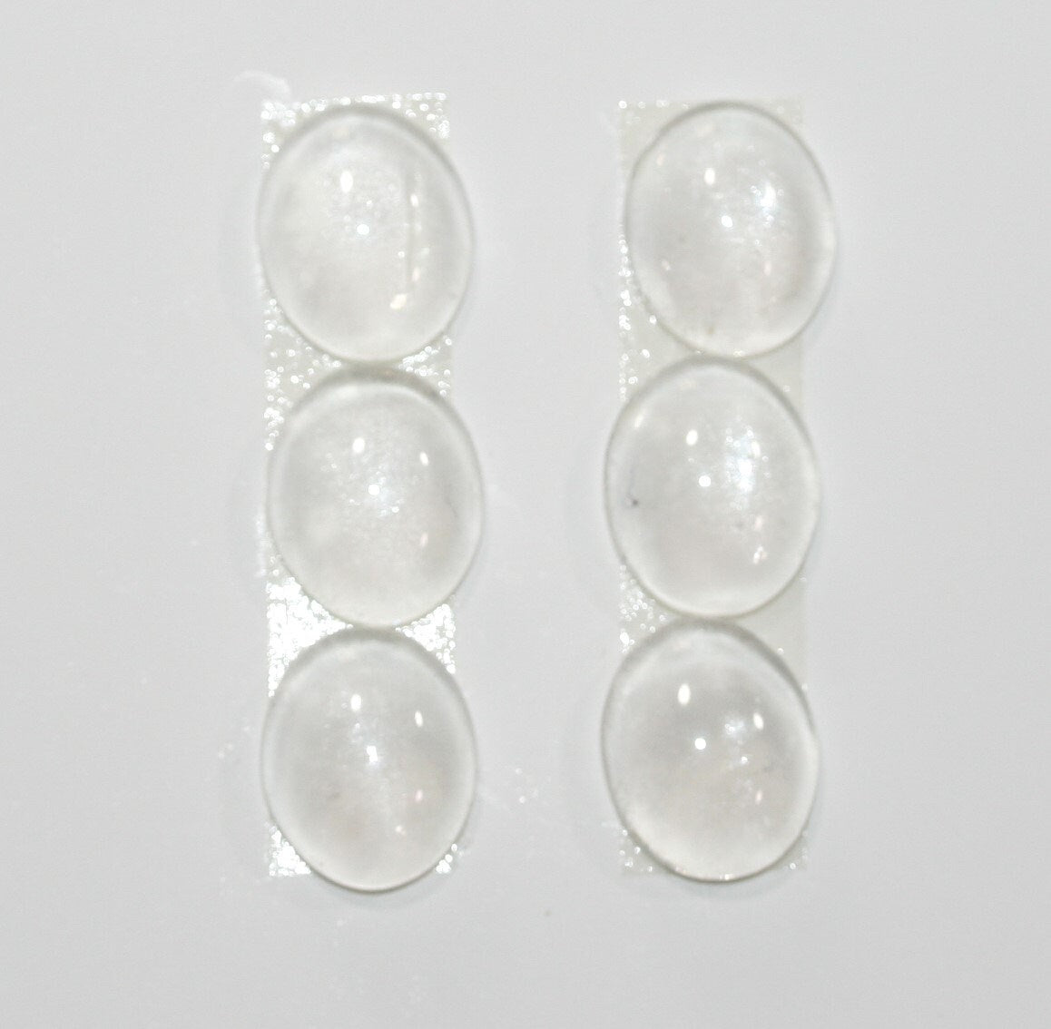 Lote de 6 cabujones ovalados lisos de cuarzo cristal de roca de 12 x 10 mm. (6 piezas).