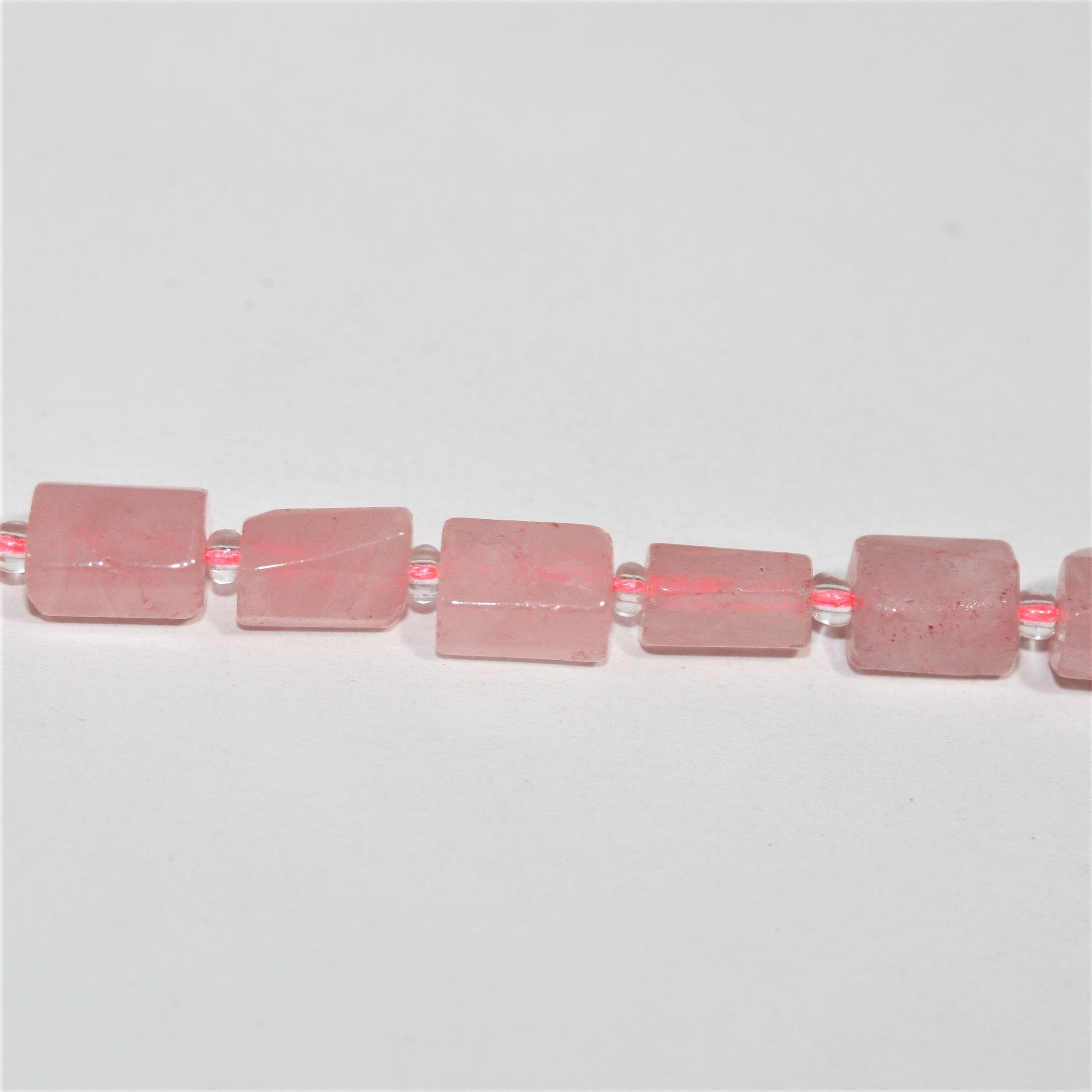 Cuentas de cuarzo rosa facetadas de 16" (10 x 7 mm). Longitud aproximada: 40 cm.