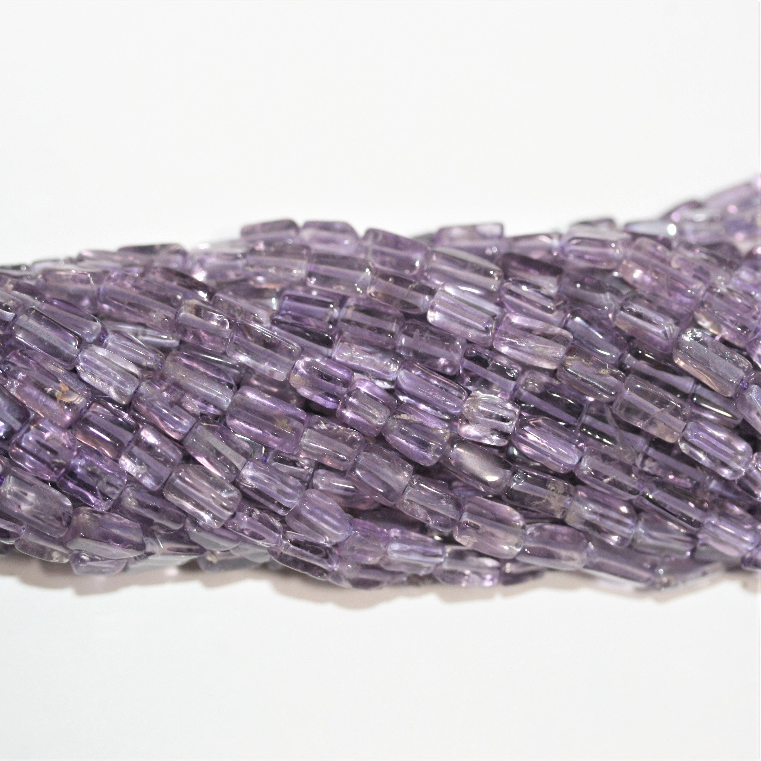 13" St Amethyst Smooth Prism Beads 6x3mm. Approx.- Strand 33cm.