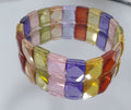 Pulsera elástica de circonitas cúbicas multicolor con cuentas facetadas de 11 x 9 mm. Proveedor de joyas con cuentas de doble perforación. Poder curativo.