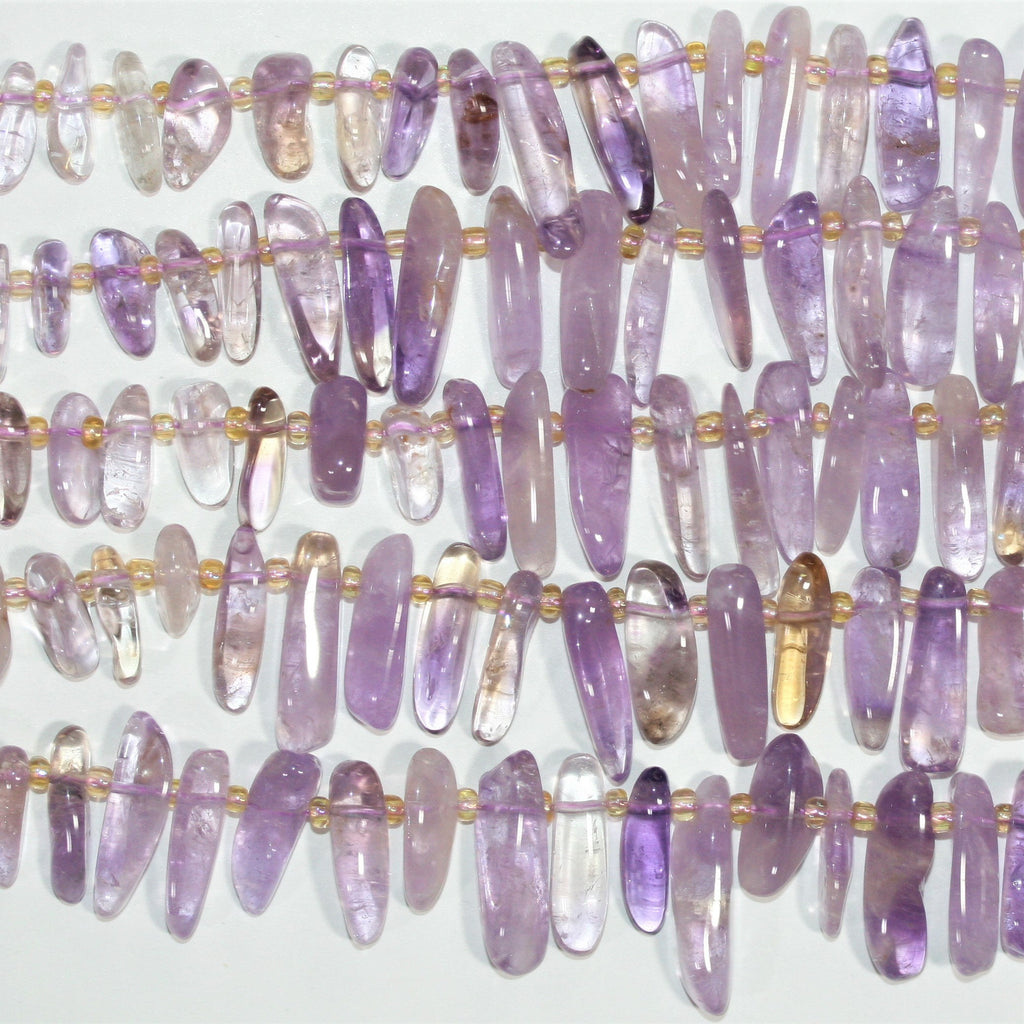 Perles bâtonnets lisses dégradées en Sainte-Amétrine, 15 pouces (11 x 4 à 23 x 8 mm). Longueur approximative du fil : 39 cm.