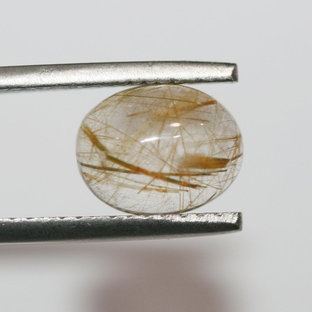 Lote de 8 cabujones ovalados de cuarzo rutilado de 10 x 8 mm. (8 uds.)