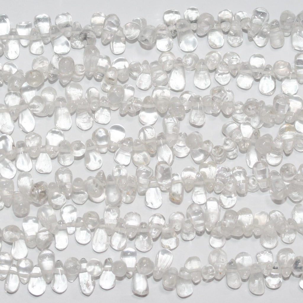 Perles en cristal de roche lisses en forme de goutte, 15 pouces (7 x 3 mm) environ. Longueur du fil : 38 cm.