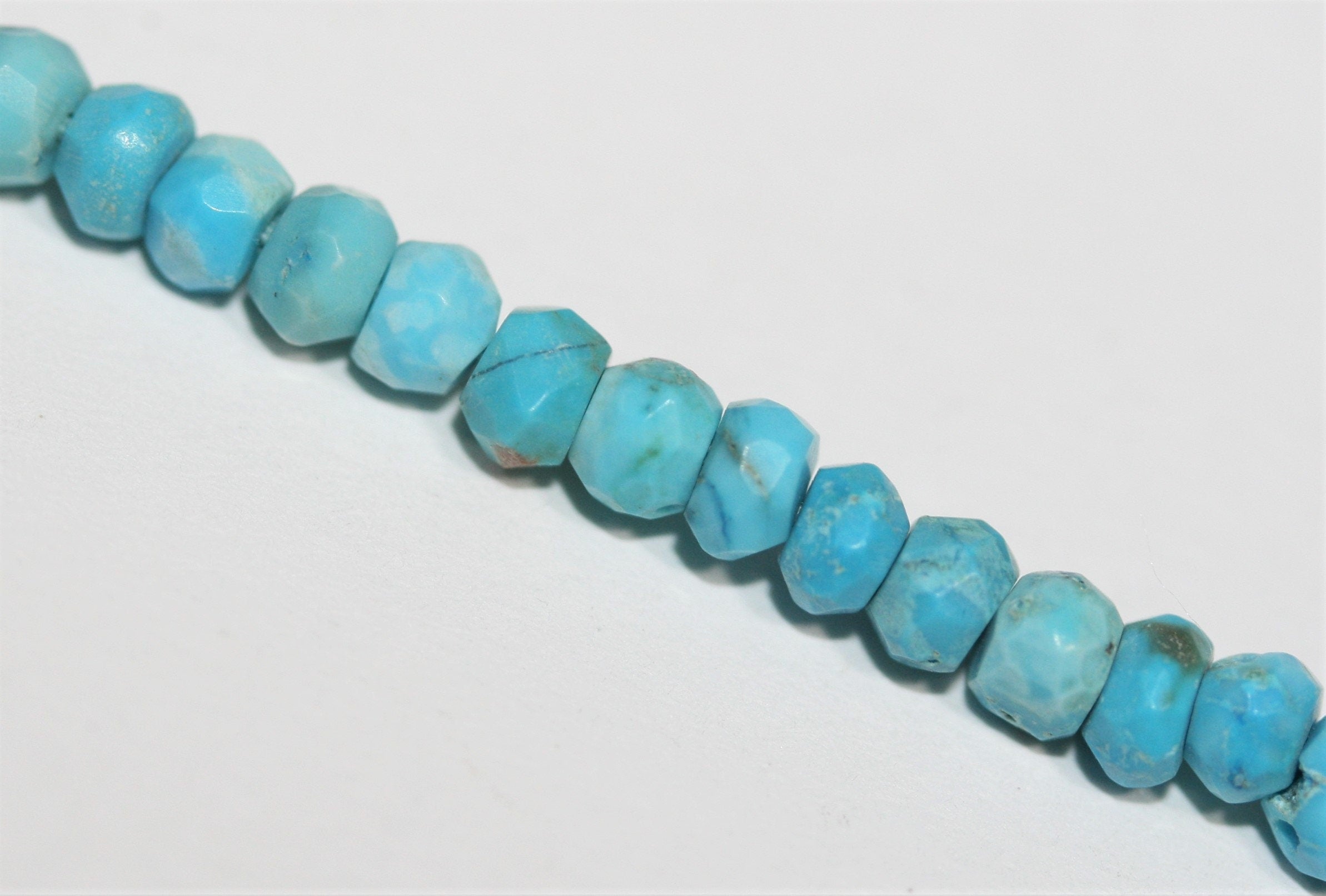 13" St Turquoise Faceted Rondelle Beads 4x3mm.-Strand 34cm.