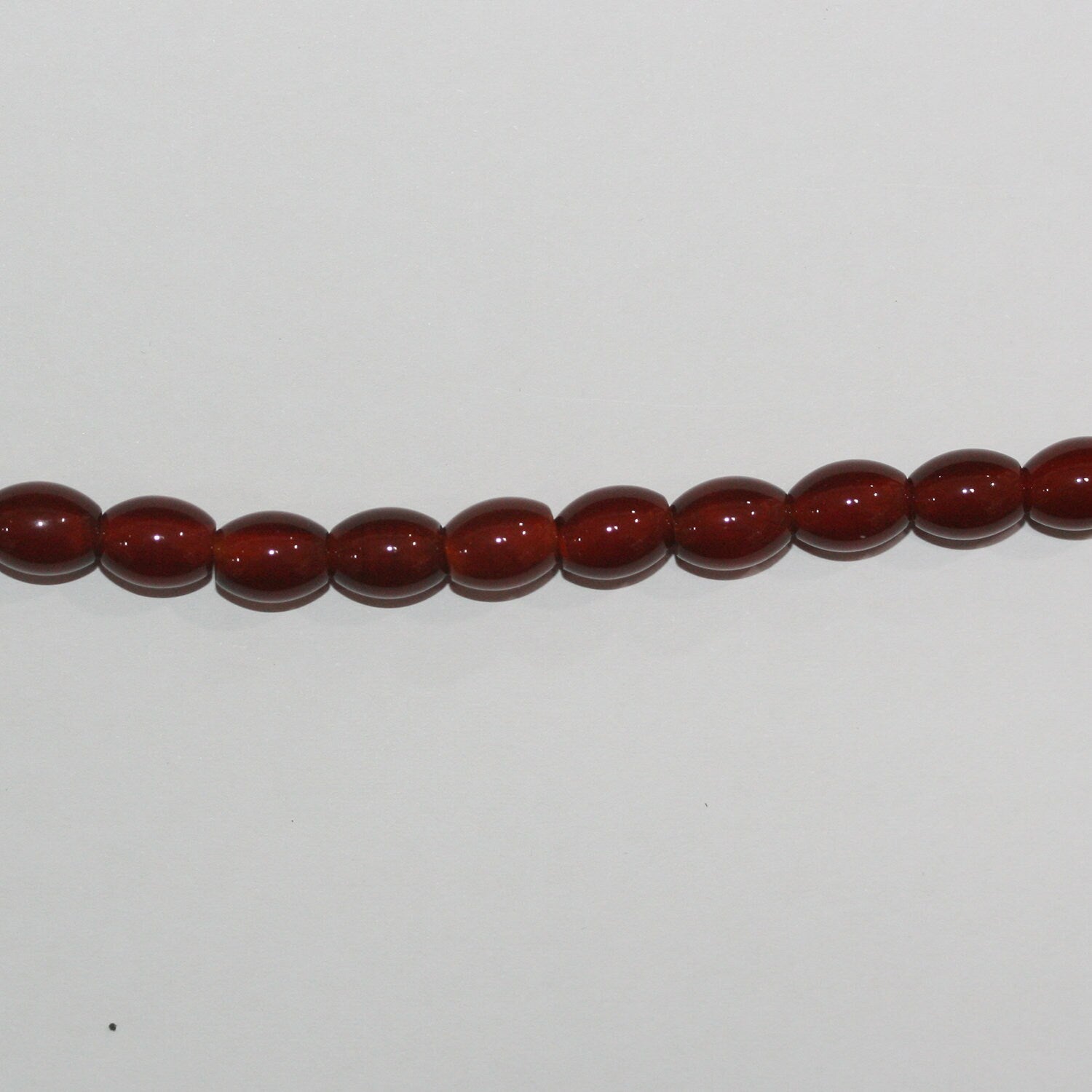 16" Cuentas de barril liso de Santa Cornalina 8x6 mm.-Hilo 40 cm.