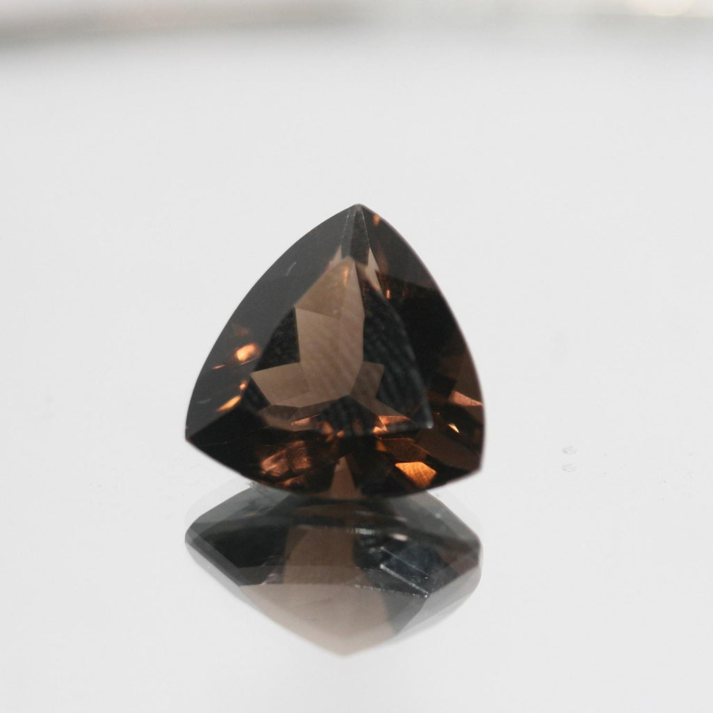 Lote de 2 trillones de cuarzo ahumado facetado de 14 mm.