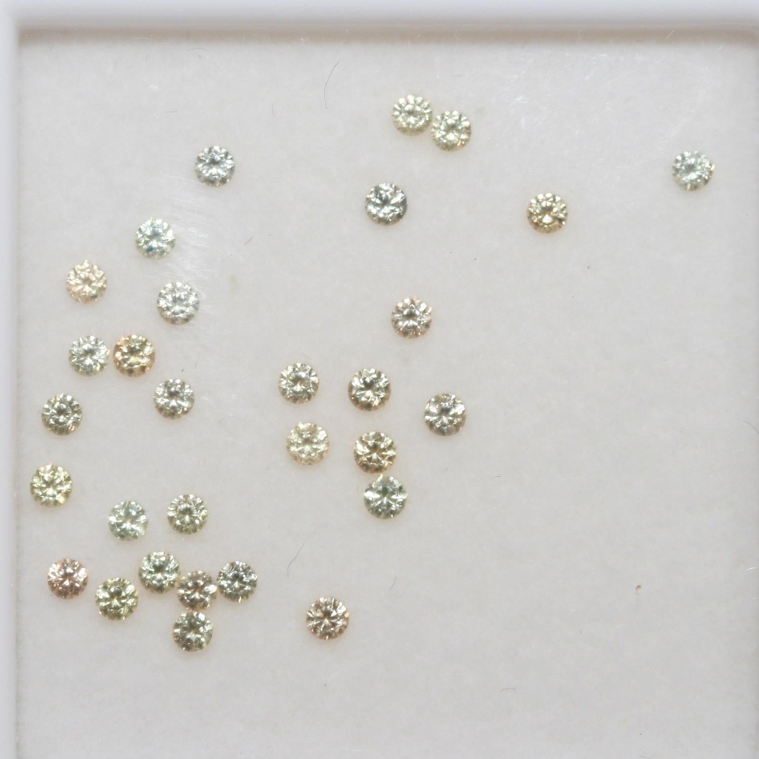 Lote de zafiro amarillo redondo facetado de 2 mm. Aprox. 1 quilate.