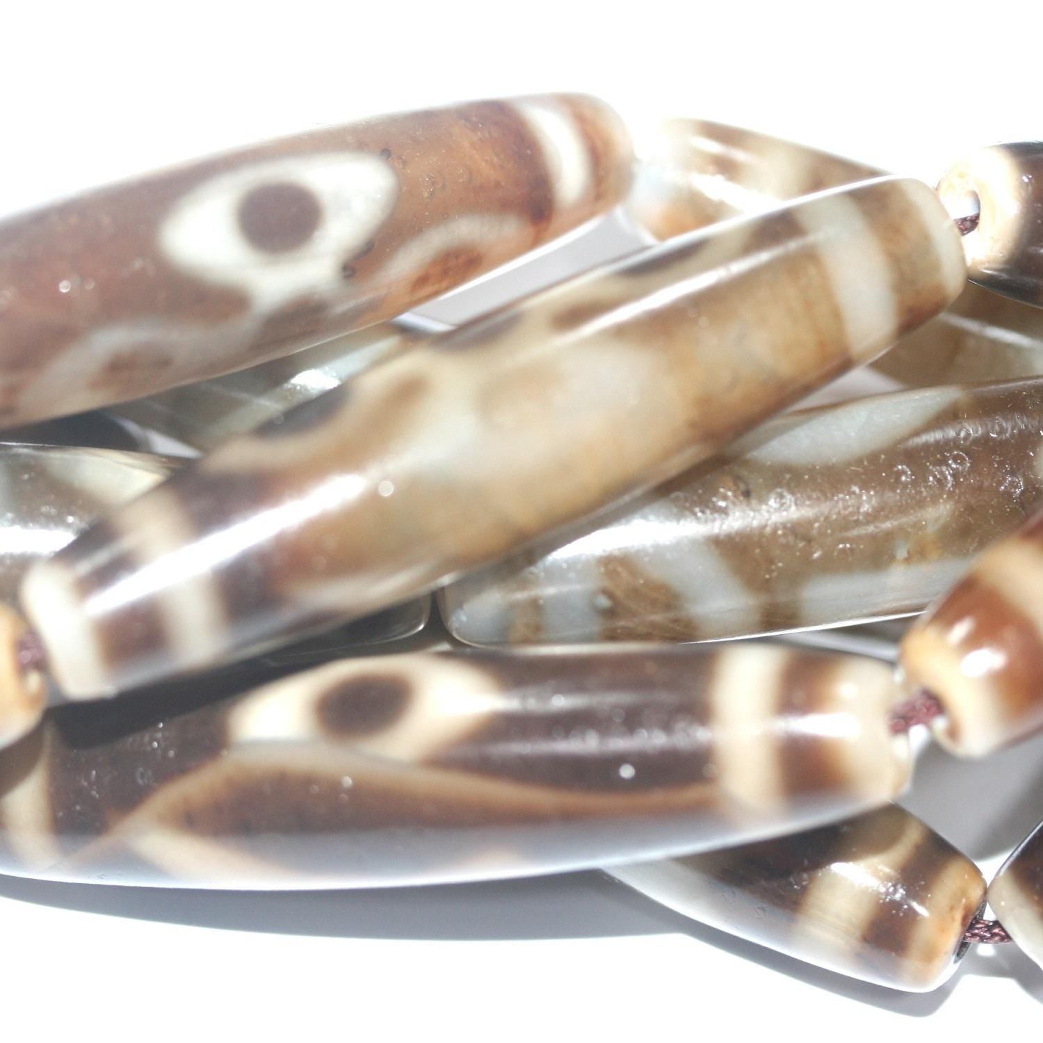 Cuentas de barril liso de ágata marrón de 16", 57 x 13 mm aprox. - Hilo de 40 cm.