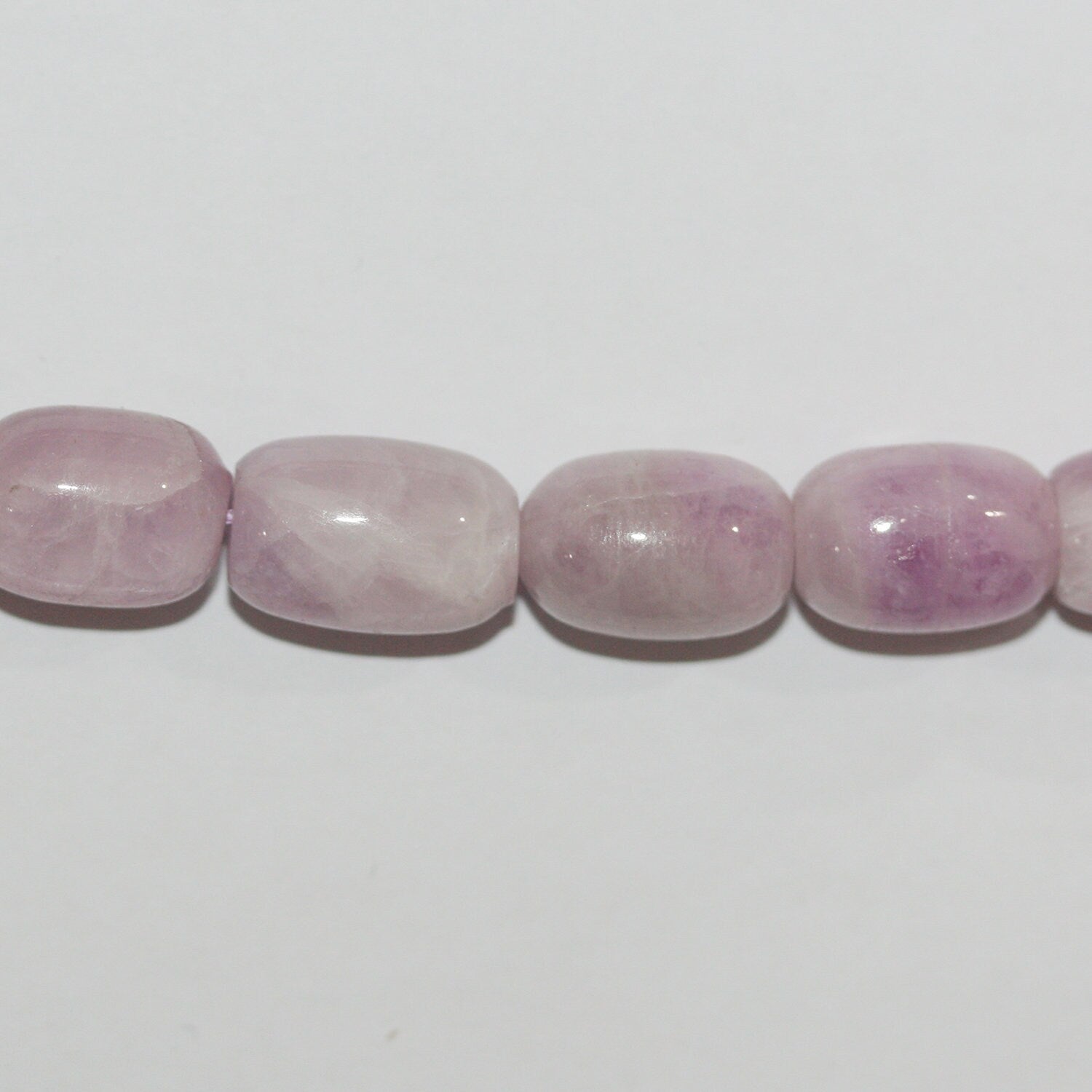 Perles cylindriques lisses en kunzite St de 15 pouces (16 x 10 mm). Longueur approximative du fil : 39 cm.