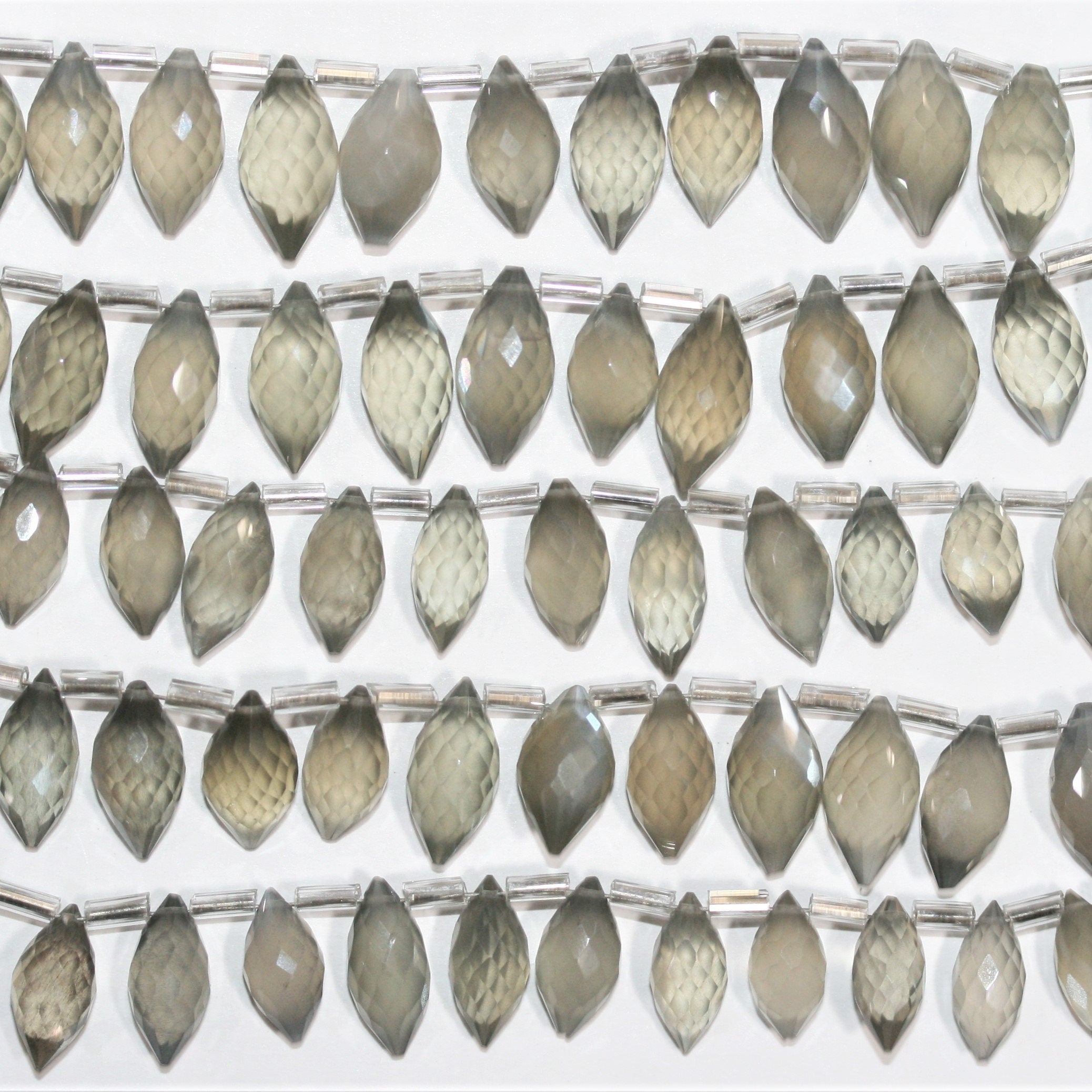 Cuentas de piedra lunar gris St. facetadas de 7", 12 x 7 mm. Aprox. - Hilo de 18 cm.