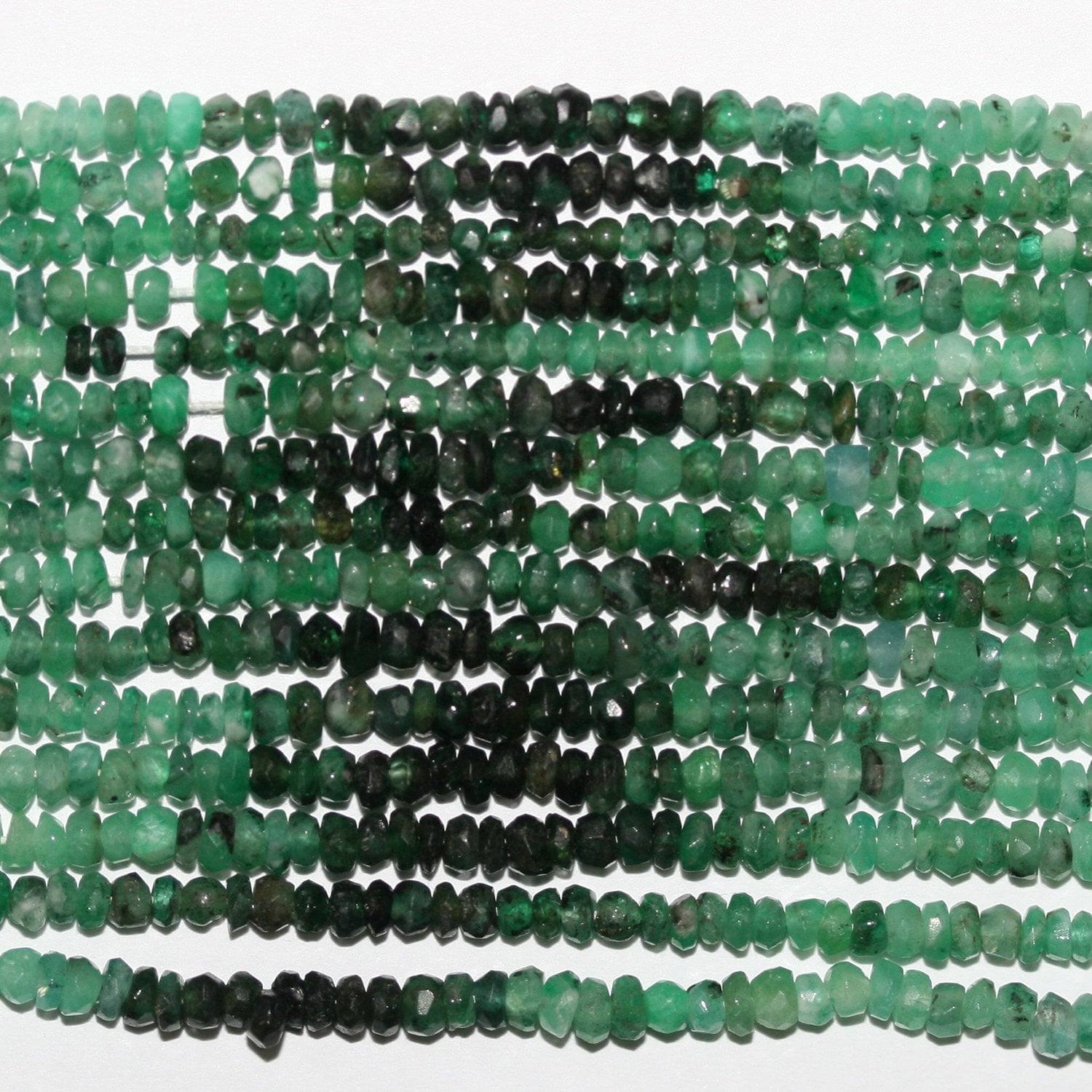 15" perles rondelles à facettes émeraude 2,5 x 1,5 mm - Fil de 39 cm.