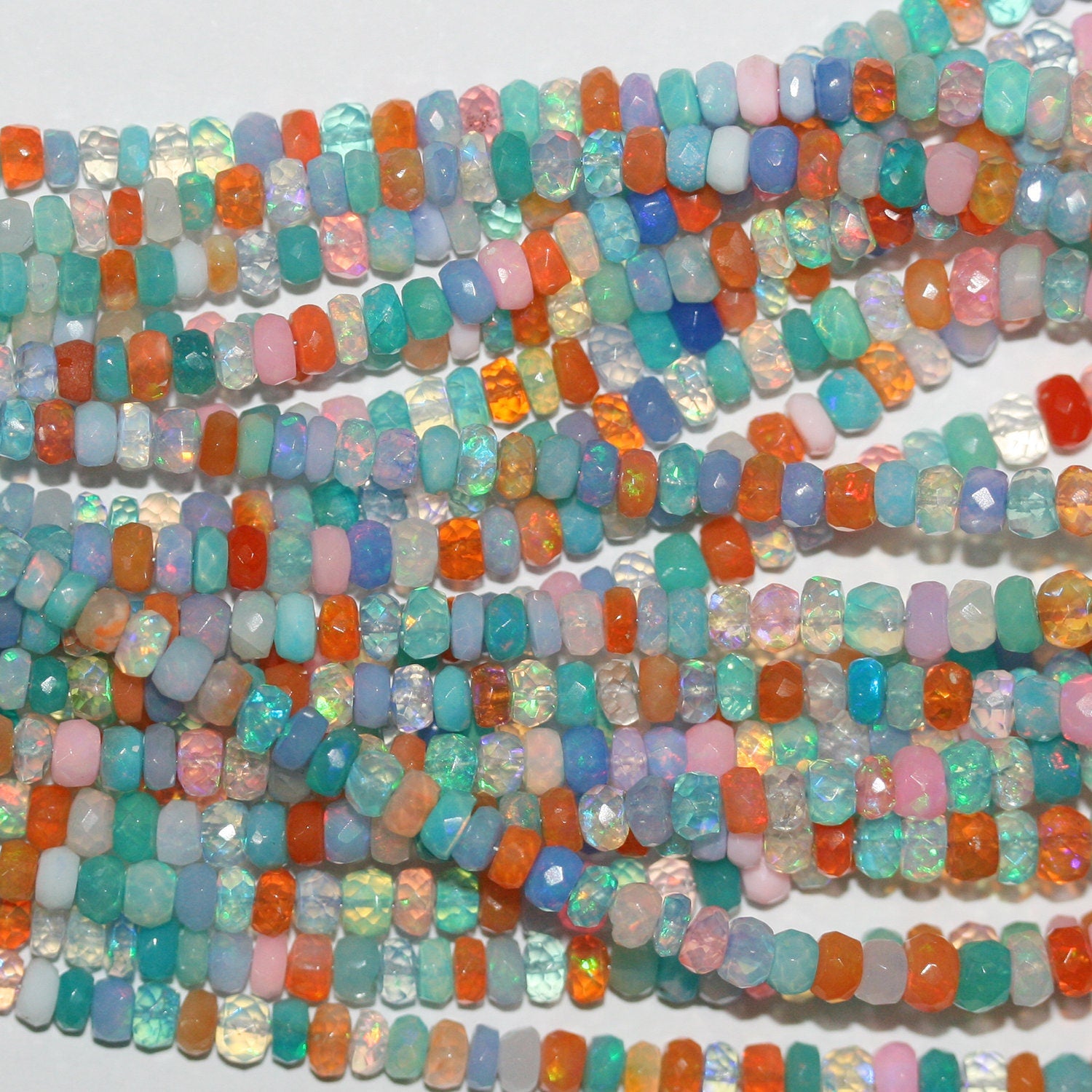 Cuentas redondas facetadas graduadas de ópalo etíope multicolor de 16" St 3x2-5x3 mm - Hilo de 40 cm.