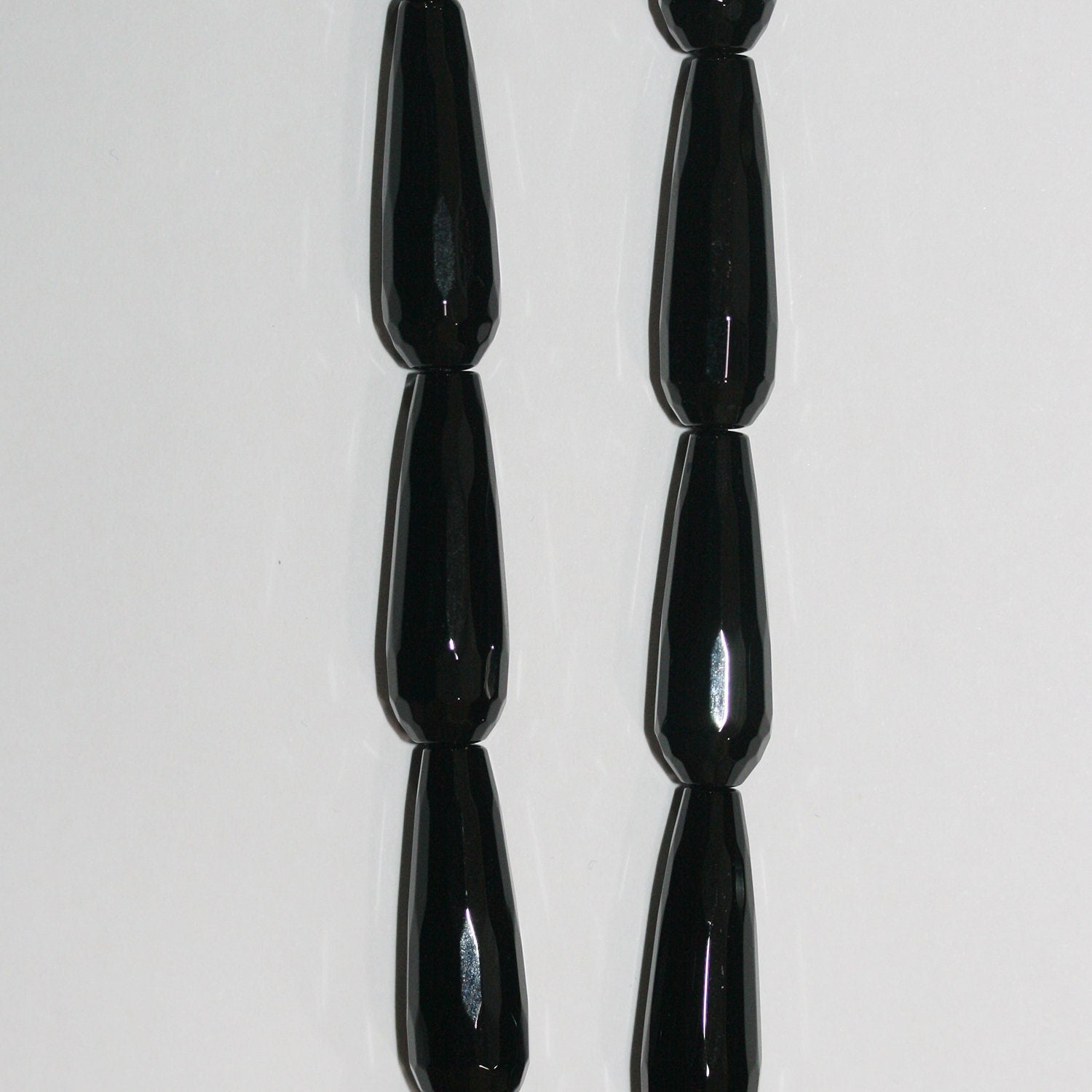 Cuentas facetadas de ónix St. de 16", 30 x 10 mm, hilo de 40 cm.