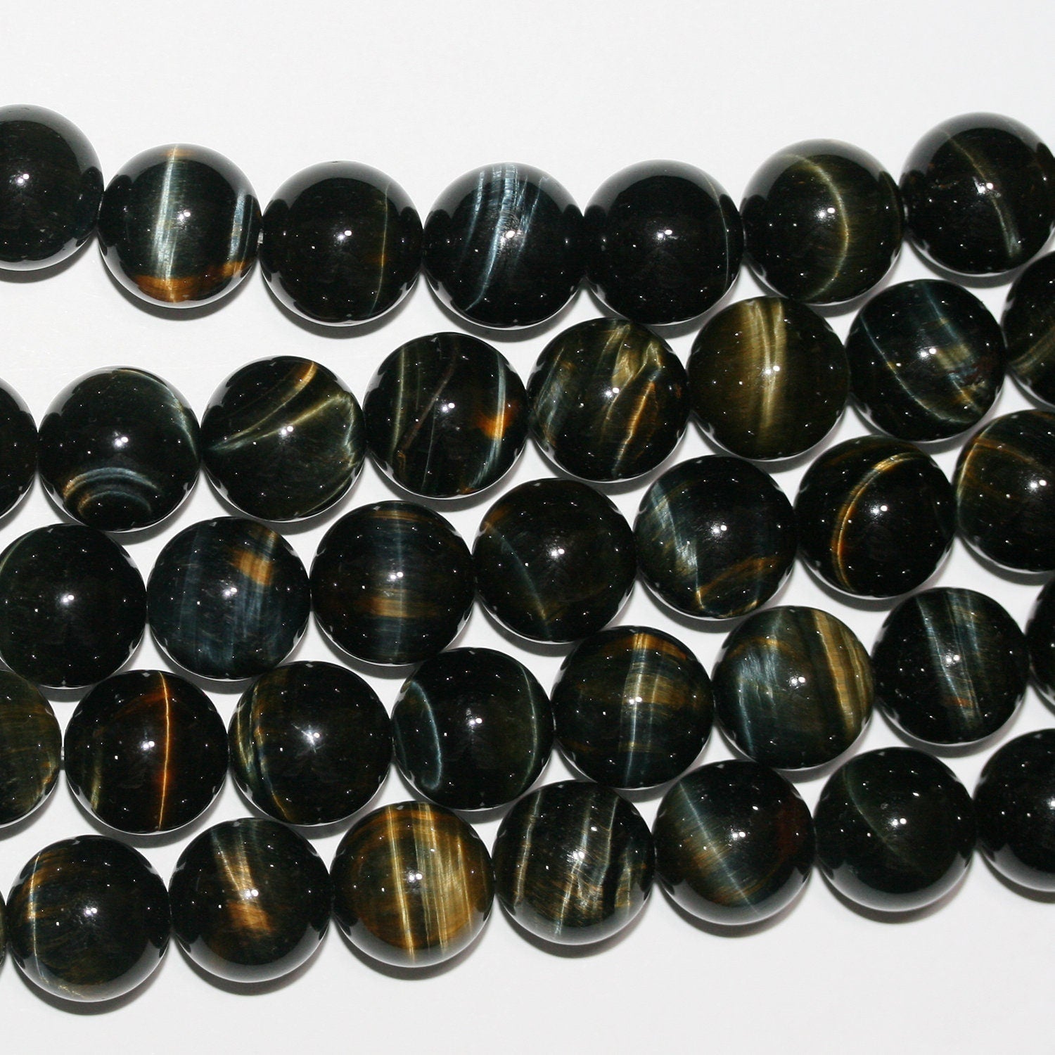 Perles rondes lisses œil de tigre St 15" 14 mm.-Rig 39 cm.