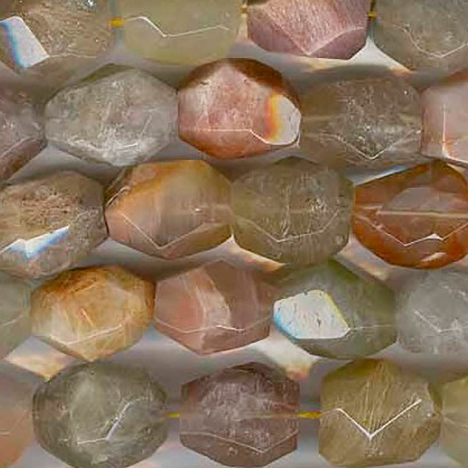 Cuentas facetadas de cuarzo rutilado de 16" (18 x 16 mm). Hilo de 40 cm aprox.