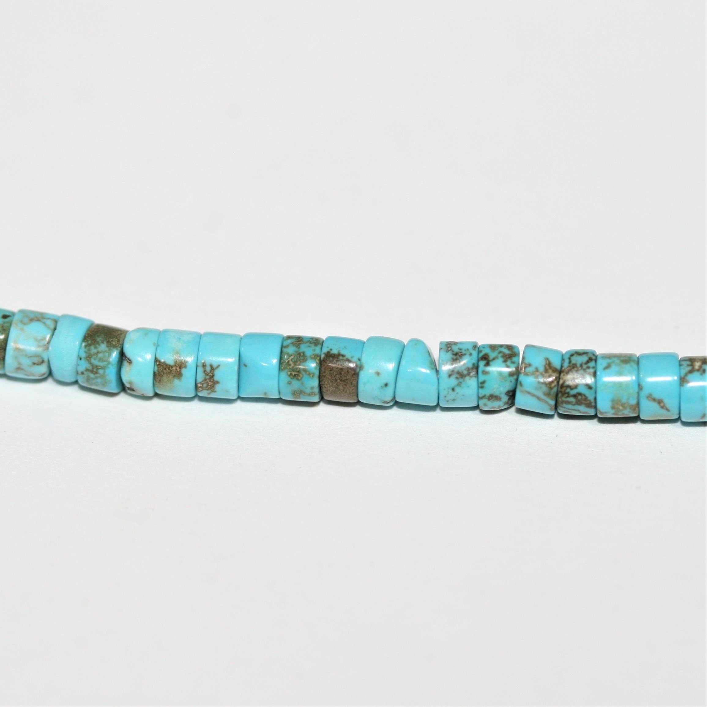Perles rondelles lisses en turquoise St. 15" 4x2mm.- Brin 39cm.