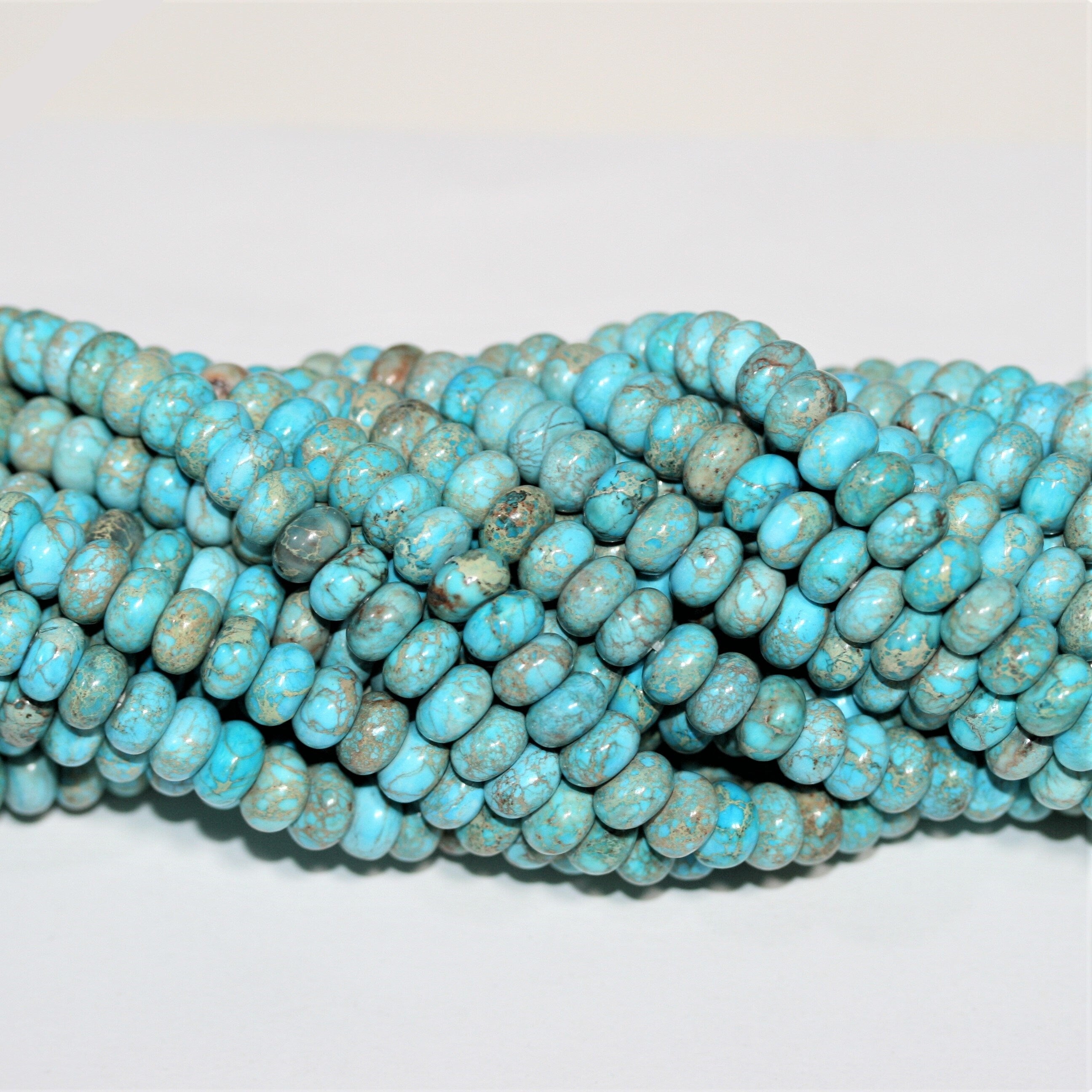 Cuentas redondas lisas de turquesa St. de 16" de 8 x 5 mm - Hilo de 40 cm.