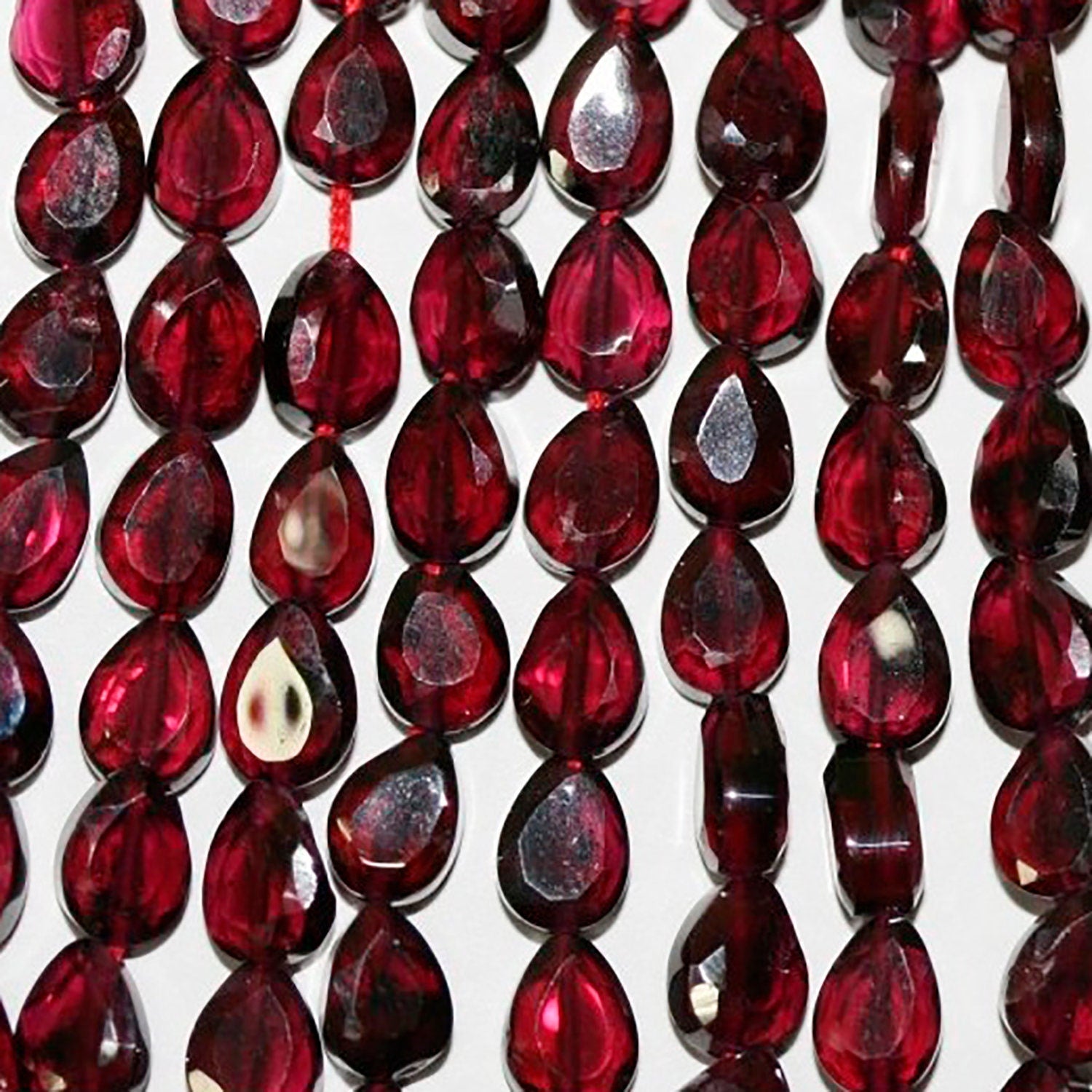 13" St Garnet Faceted Drop Beads 6x4mm.-Strand 37cm