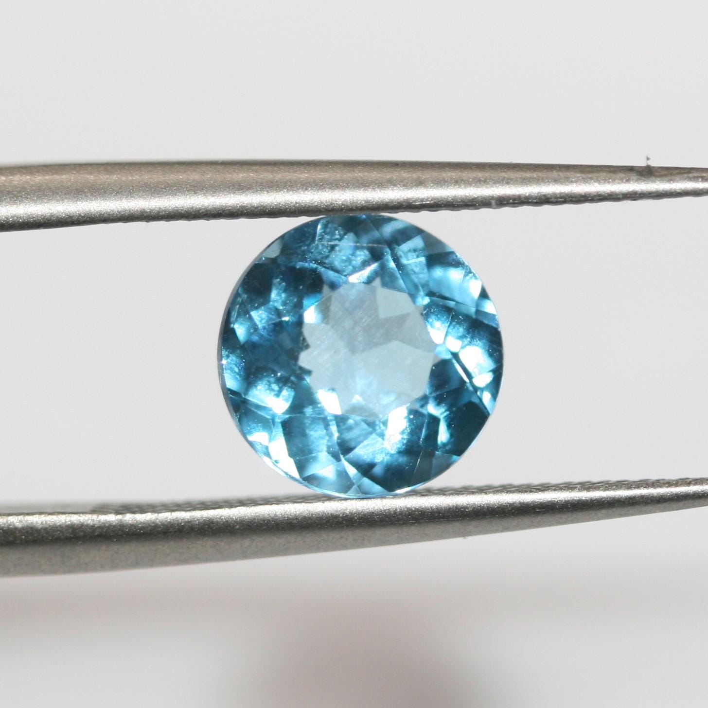 Lote de 4 topacios azules suizos facetados redondos de 6 mm. (4 piezas)