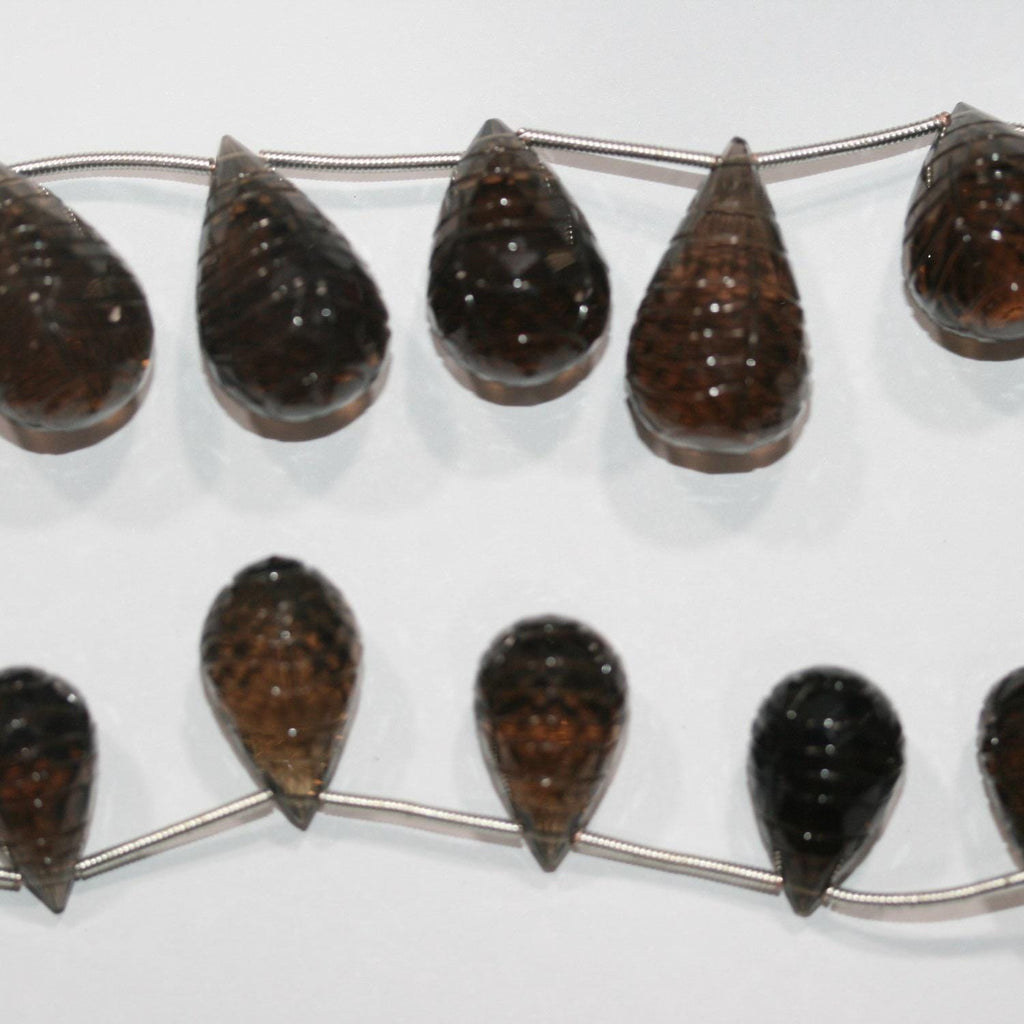 Cuentas de cuarzo ahumado talladas de 18 x 10 mm a 24 x 16 mm. Tira de 19 cm aprox. - Ref. 14890