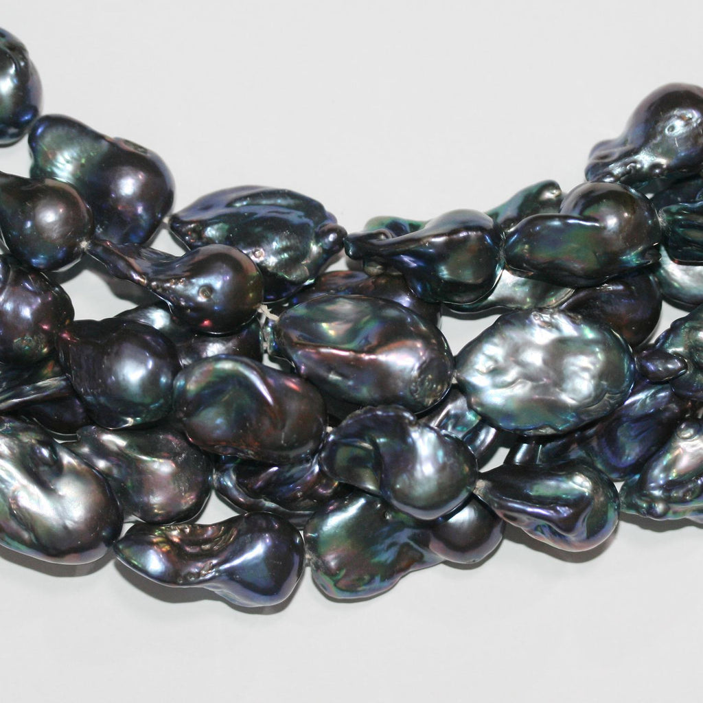 Perla Barroca Gris de Agua Dulce de 16" (24 x 15 mm). Hilo aproximado de 40 cm. Precios al por mayor.