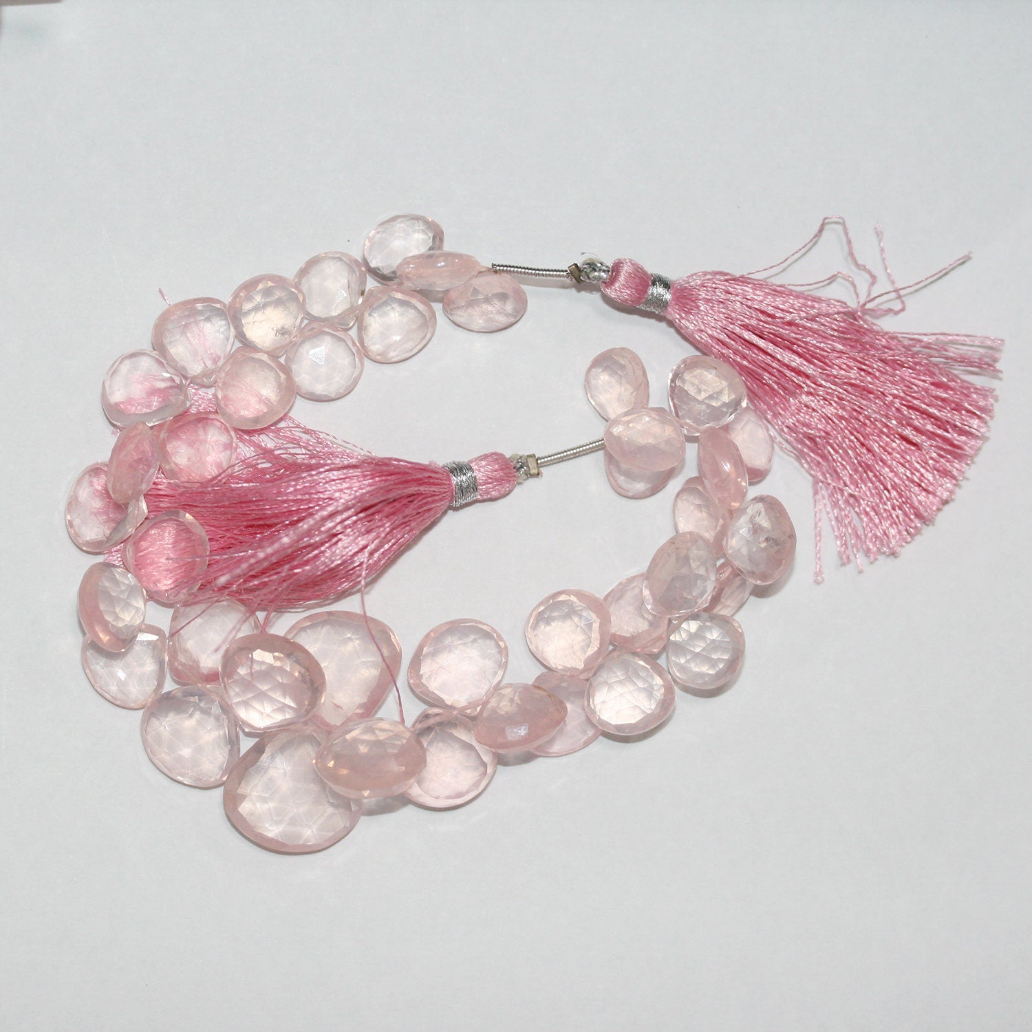 Perles en quartz rose St à facettes en forme de goutte, de diamètre gradué de 10 à 14 mm environ - Fil de 20 m.