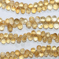 Perles en citrine facettées en forme de goutte, 7 x 5 mm environ, 20 cm de long.