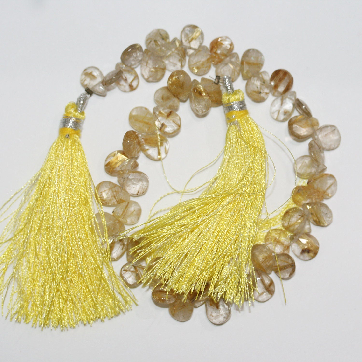 Perles en quartz rutile facettées de 23 cm (9 pouces), 10 x 7 mm, longueur 23 cm.