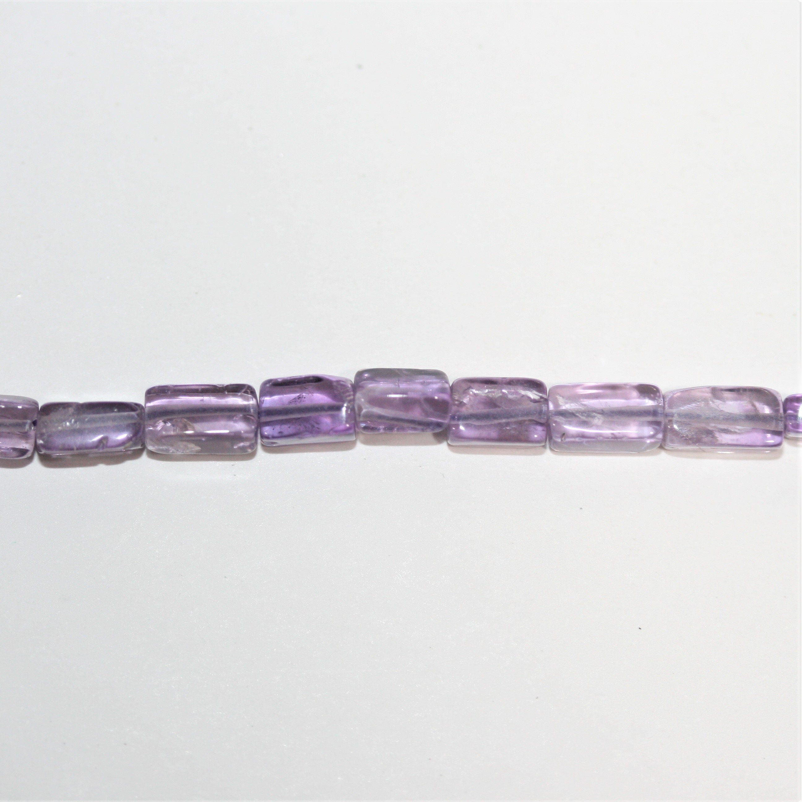 13" St Amethyst Smooth Prism Beads 6x3mm. Approx.- Strand 33cm.