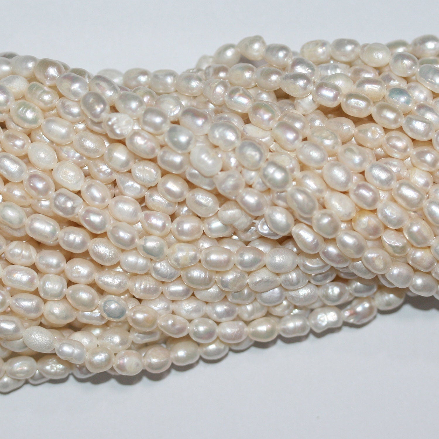 13" St FreshWater Oval Pearl 5-6mm.-Strand 35cm. -Natural Pearls wholesale Prices