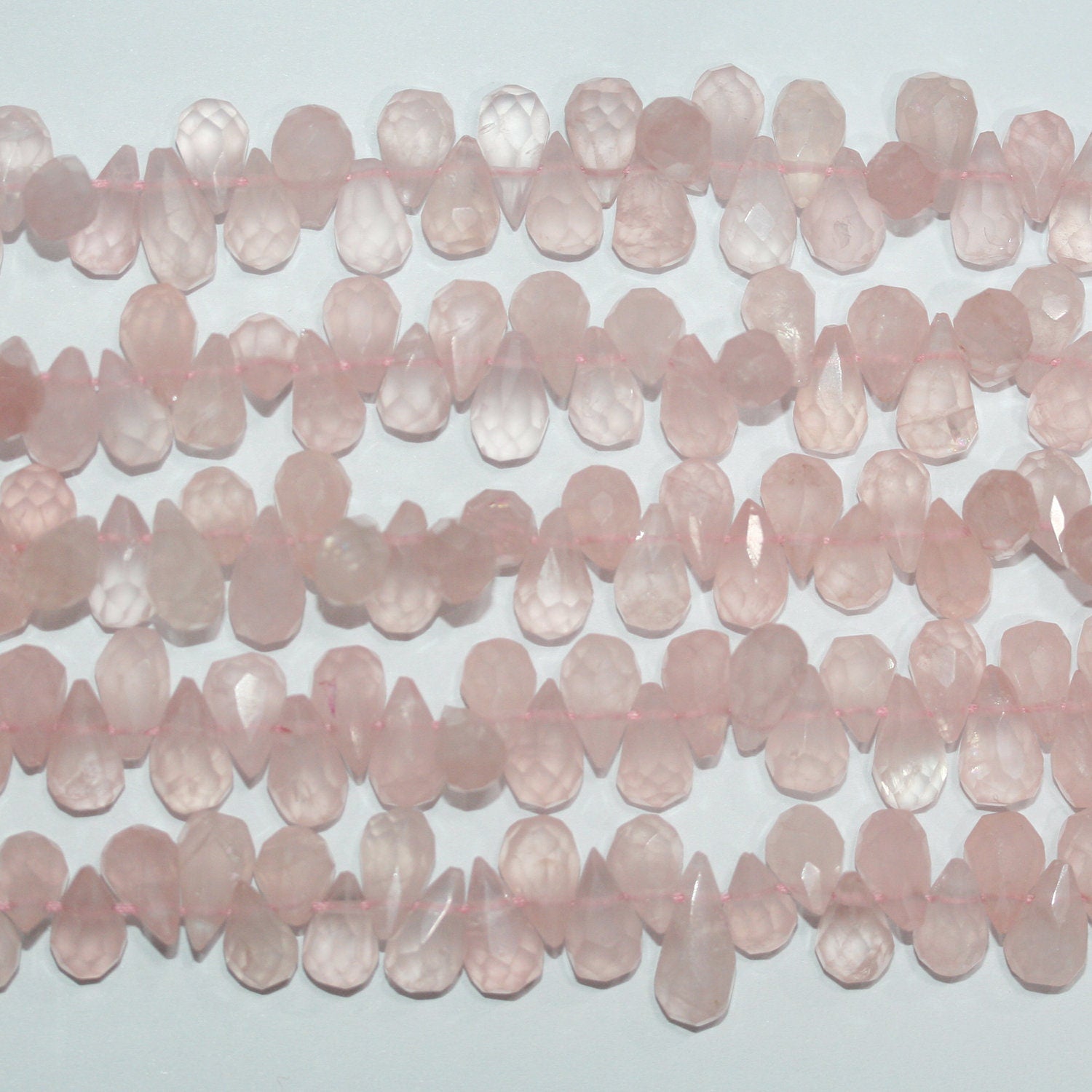 Perles en quartz rose facettées de 14 pouces (9 x 6 mm). Longueur du fil : environ 37 cm.