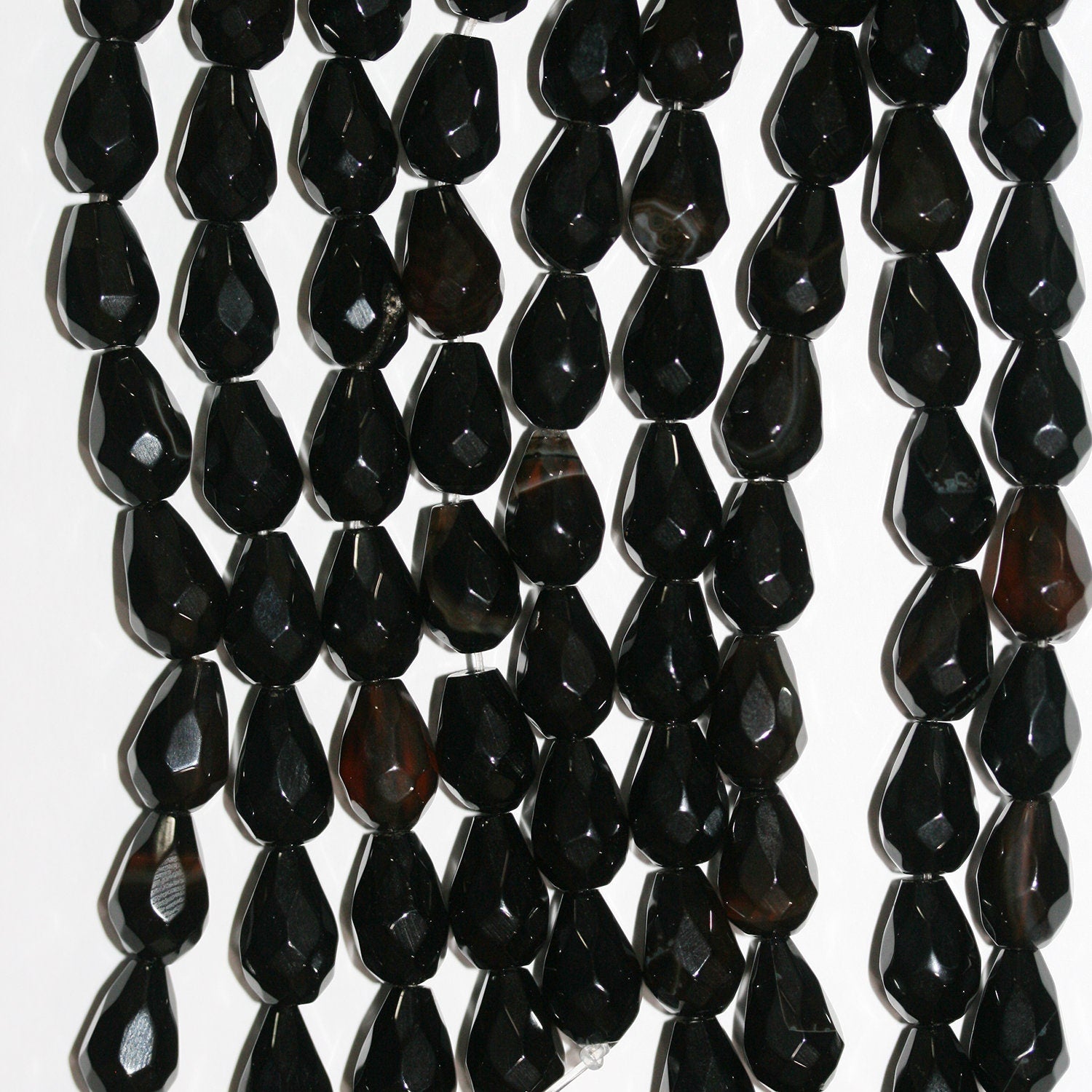 Cuentas de ónix facetado de 7" de St., 12 x 8 mm, hilo de 19 cm.