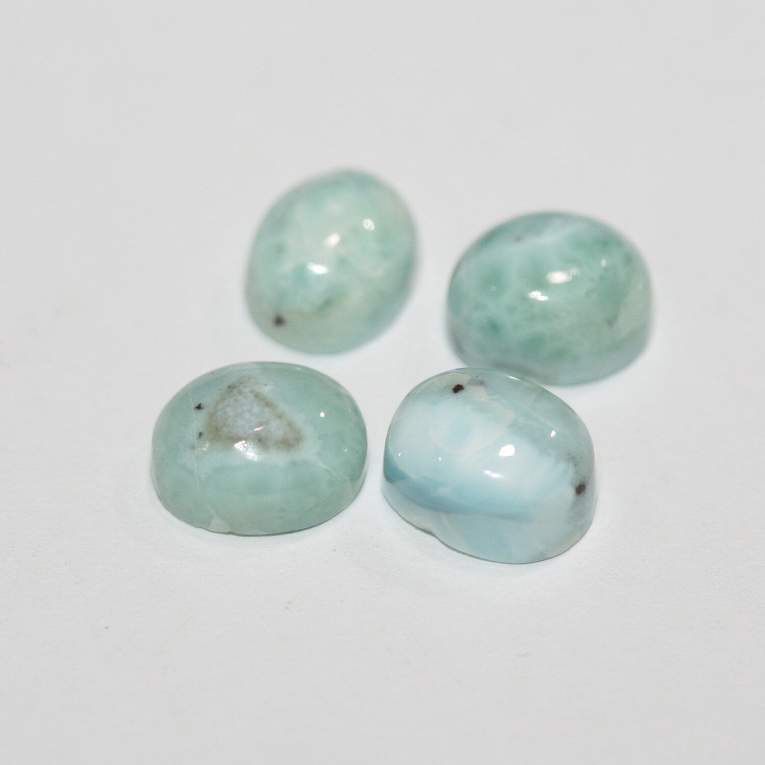 Lote de 4 cabujones ovalados de Larimar de 10 x 8 mm. (4 uds.).