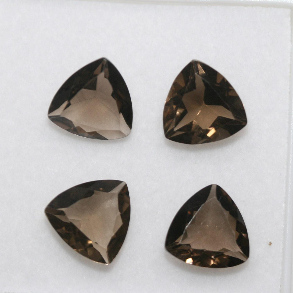Lote de 4 trillones de cuarzo ahumado facetado de 10 mm.