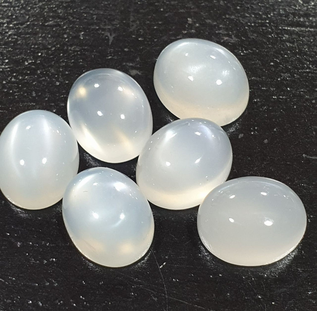 Lote de 6 cabujones ovalados de piedra lunar blanca de 11 x 9 mm. (6 uds.)