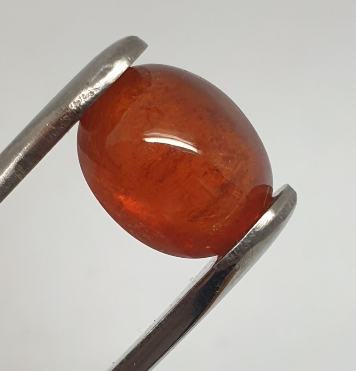 Spessartine Garnet Oval Cabochon 13x10.4mm. (10.34ct.).