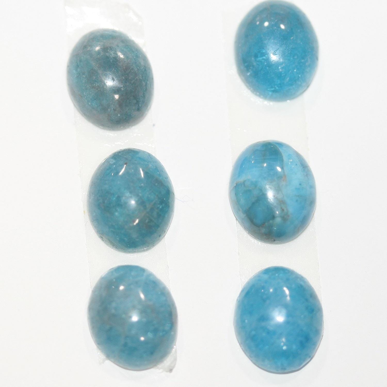 Lote de 6 cabujones ovalados lisos de apatita azul de 12 x 10 mm. (6 piezas).