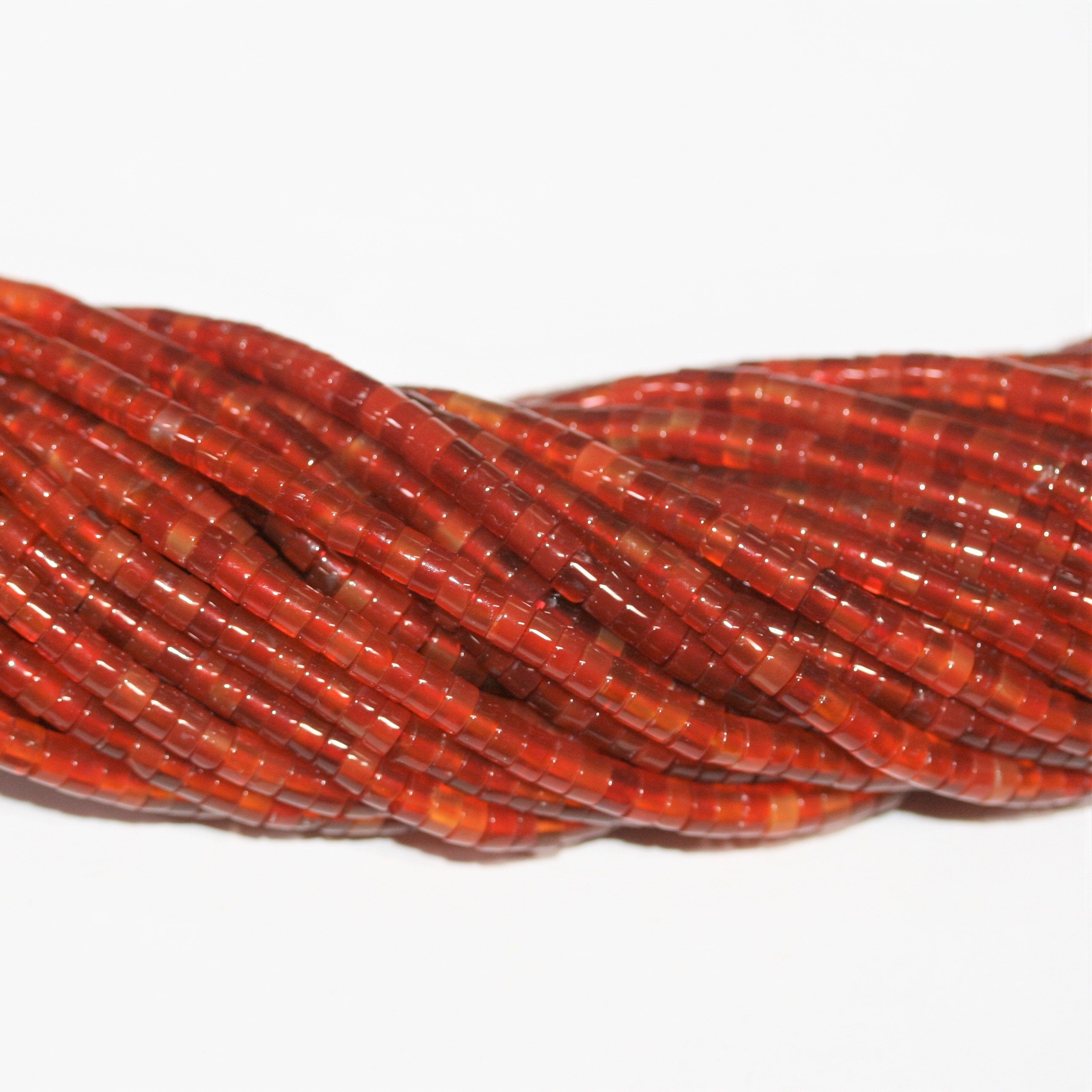 Perles disques lisses en cornaline St 15" 4x2mm.- Brin 39 cm.