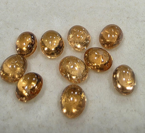 Lot de 10 grenats spessartine ovales lisses de 5 x 4 mm. Pierres précieuses naturelles.