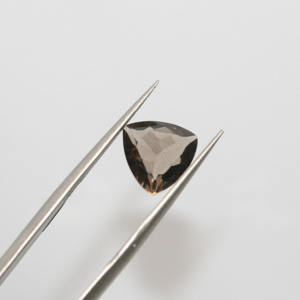 Lote de 4 trillones de cuarzo ahumado facetado de 10 mm.