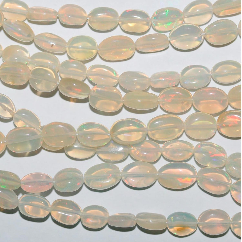 Perles ovales lisses dégradées en opale éthiopienne St de 40 cm (16 pouces), de 6 x 4 à 10 x 7 mm environ. Longueur du fil : 42 cm.
